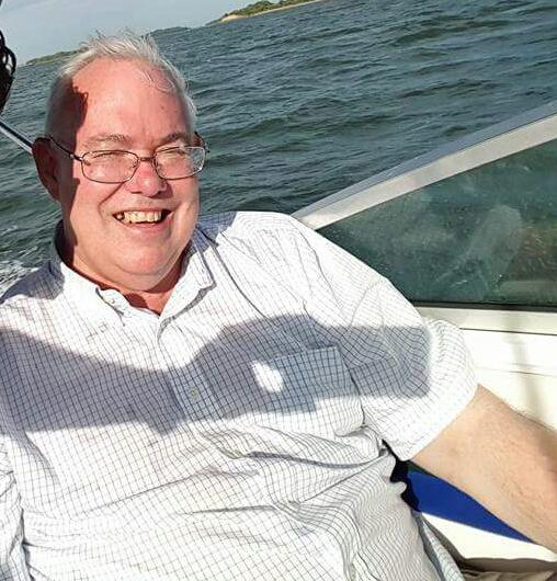 A photo of Scott Wolas, aka Eugene Grathwohl, provided to the police by one of his alleged victims. He is pictured here on a boat, sometime last year.
