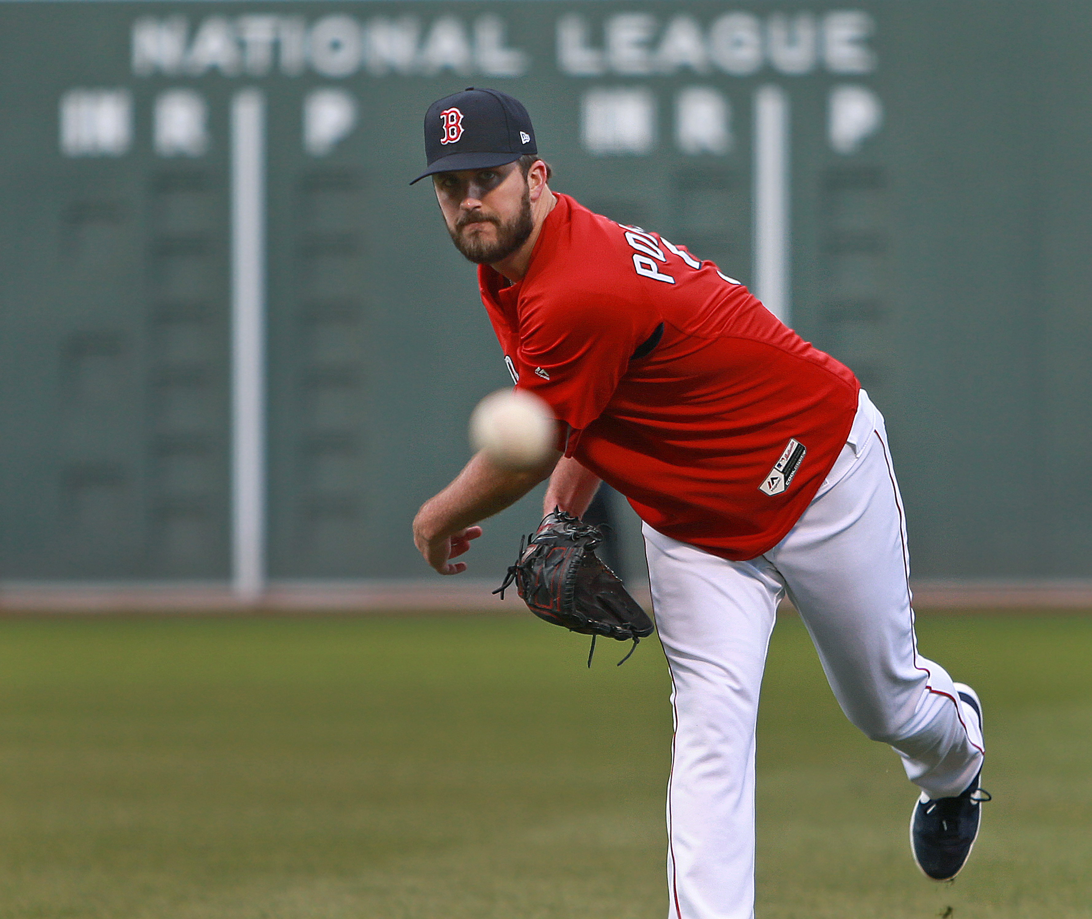 Red Sox pitcher Drew Pomeranz, who was added to the roster for the World Series, got in some throwing in the outfield before Game 2.