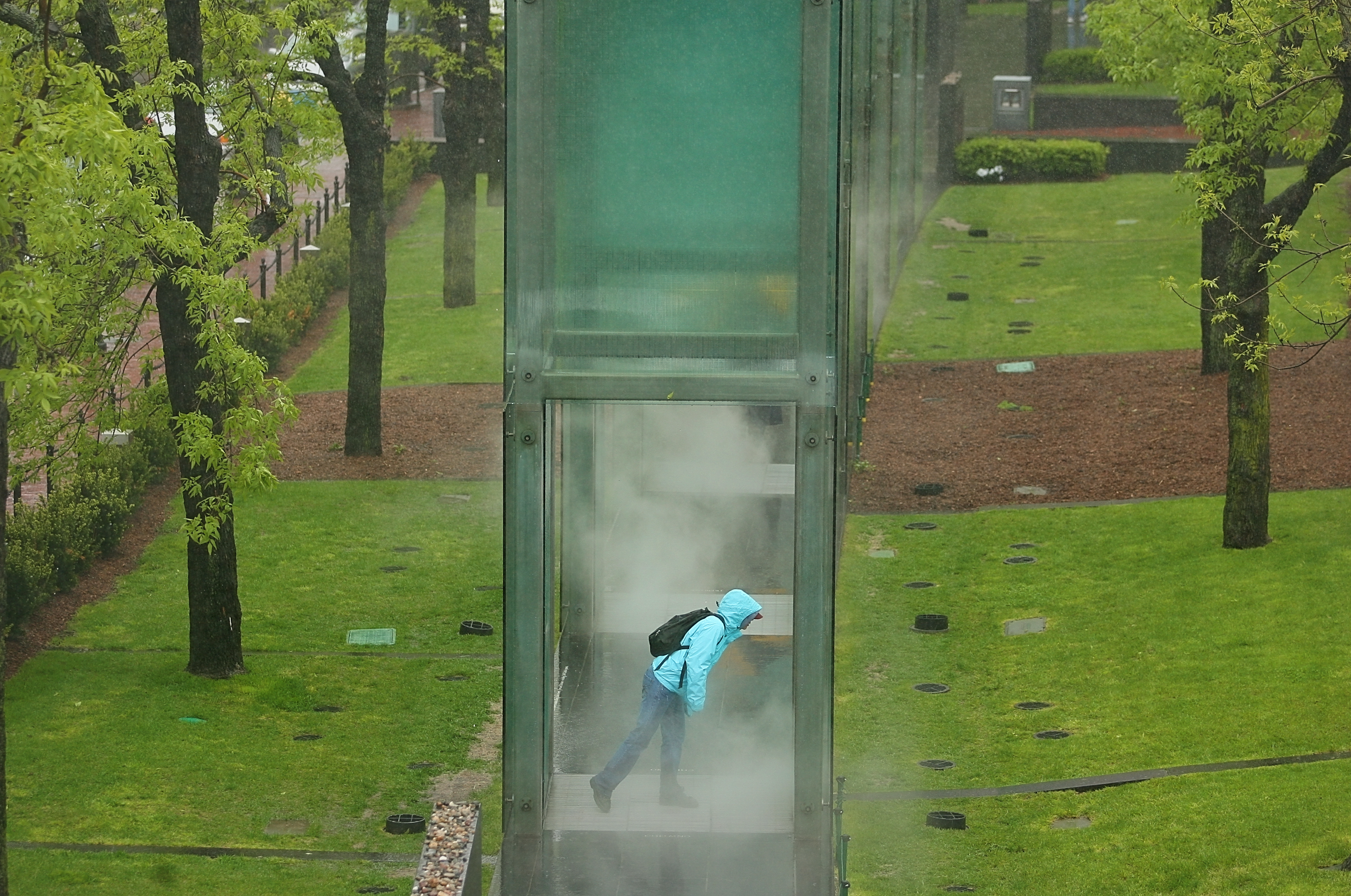 The New England Holocaust Memorial in Carmen Park on Congress Street in Boston involves a series of connected glass towers that invites visitors to walk through small jets of steam.