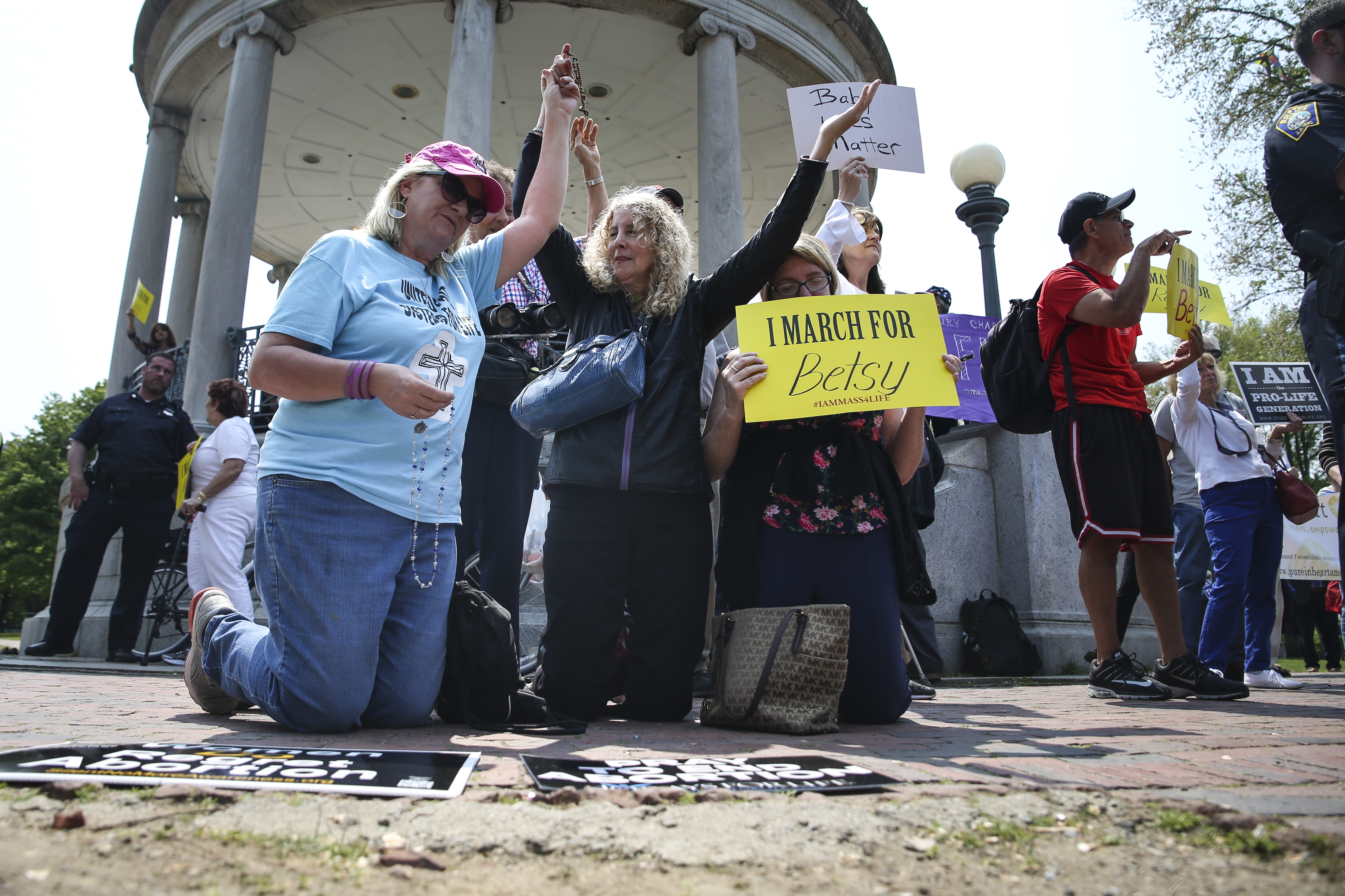 Anti-abortion activists knelt in prayer during a rally on Boston Common on Sunday afternoon.