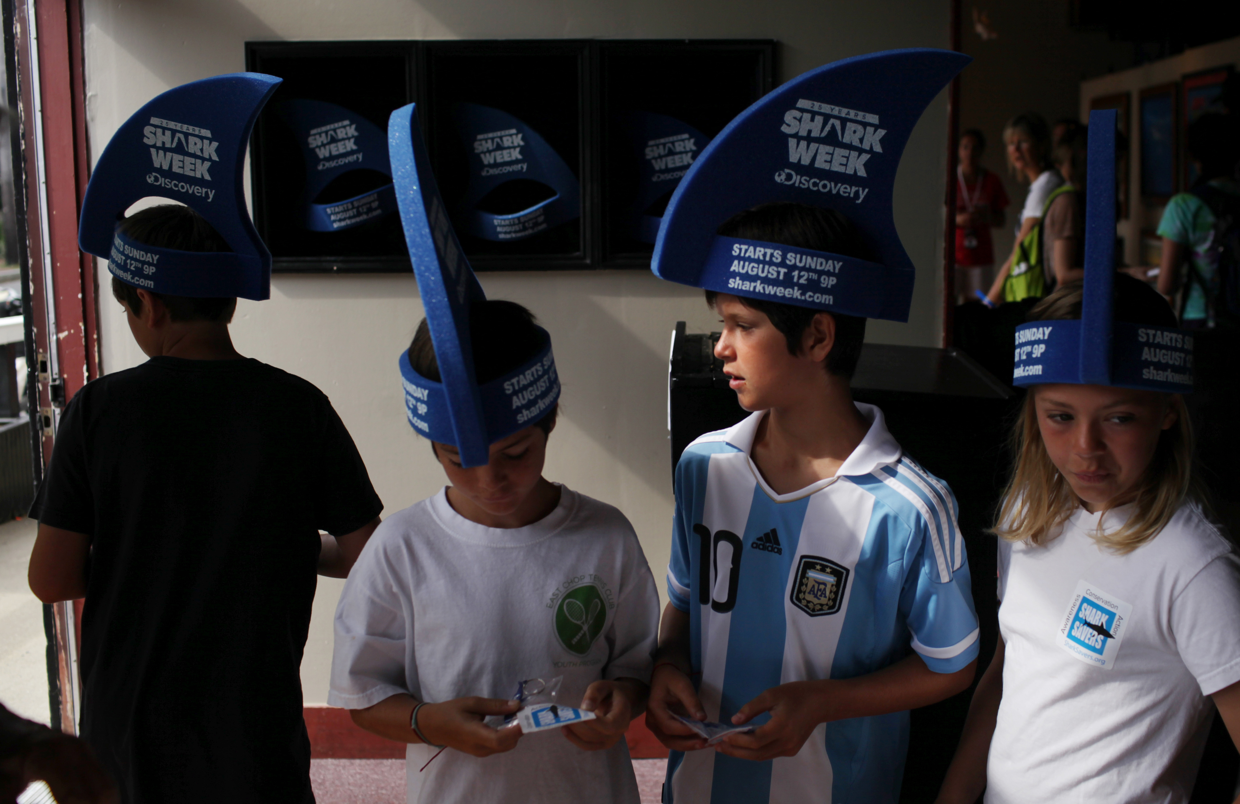 Oliver (left) and Lucy Briscoe (right) of England and Simon and Nicolas Ruderman of France collect complimentary gifts during Friday's opening ceremony.