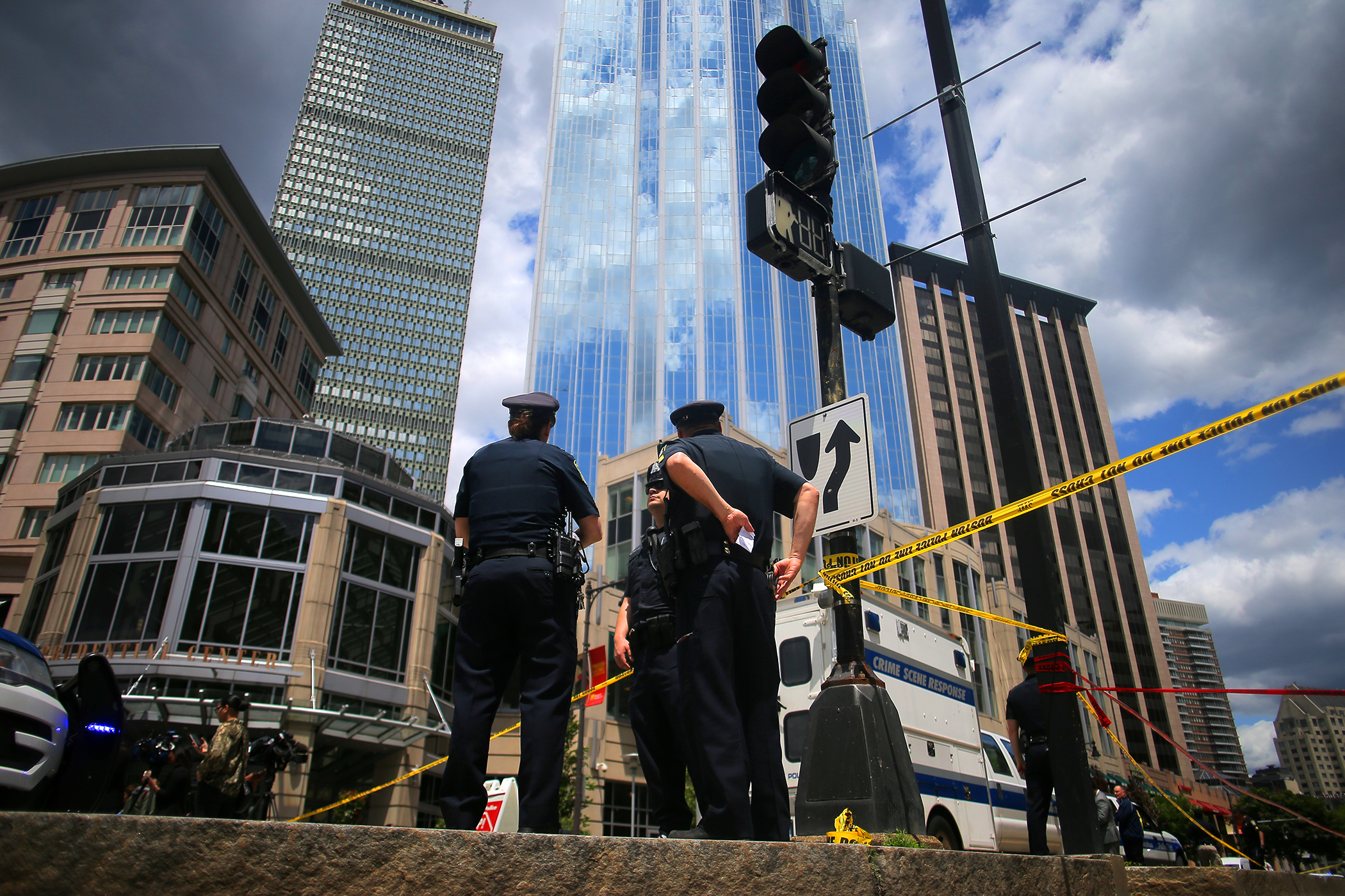Police investigate the scene of a shooting on Huntington Avenue near the Prudential Building.