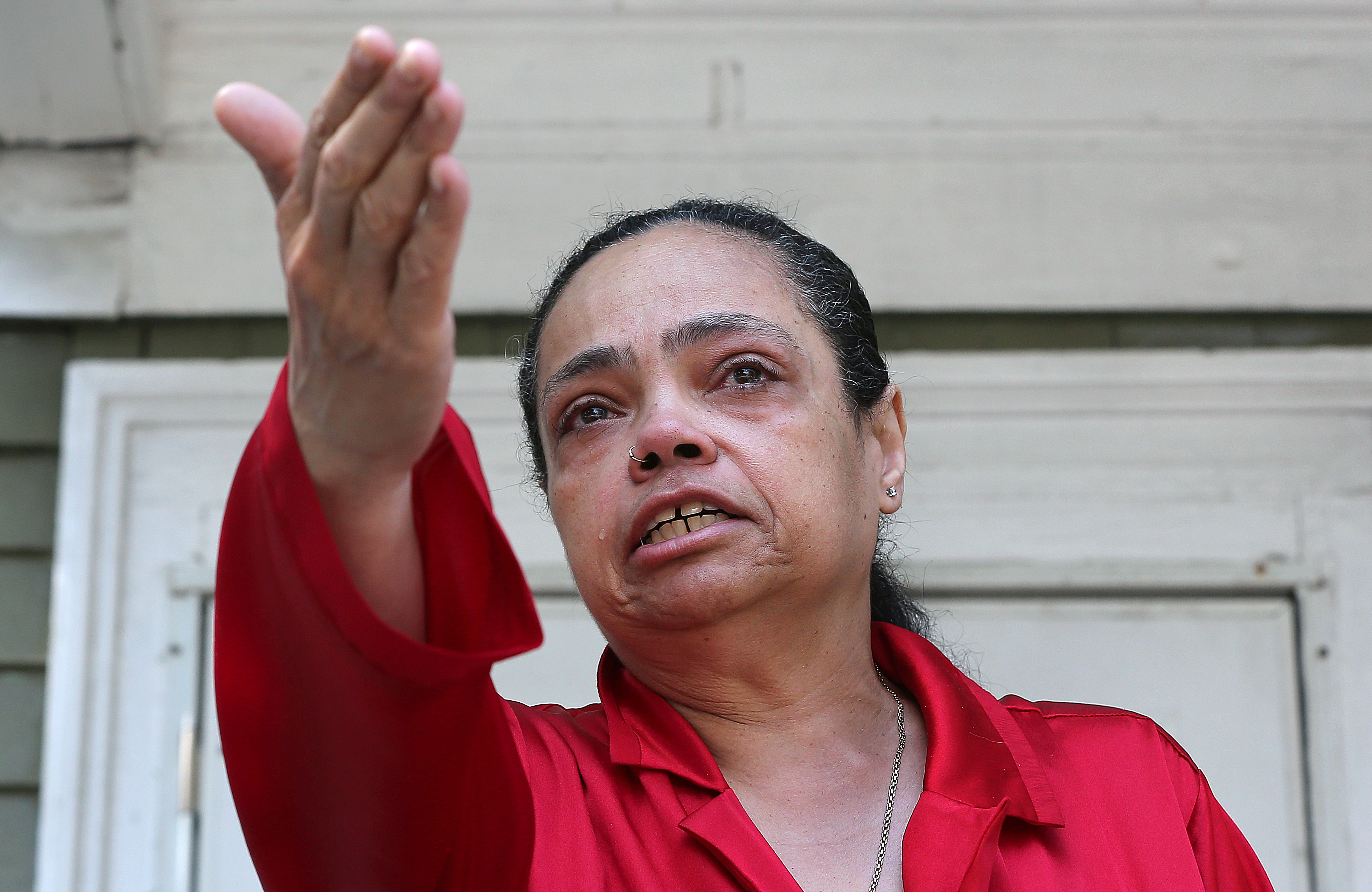 Shirley Goode motioned Thursday to where her dog was shot Wednesday.
