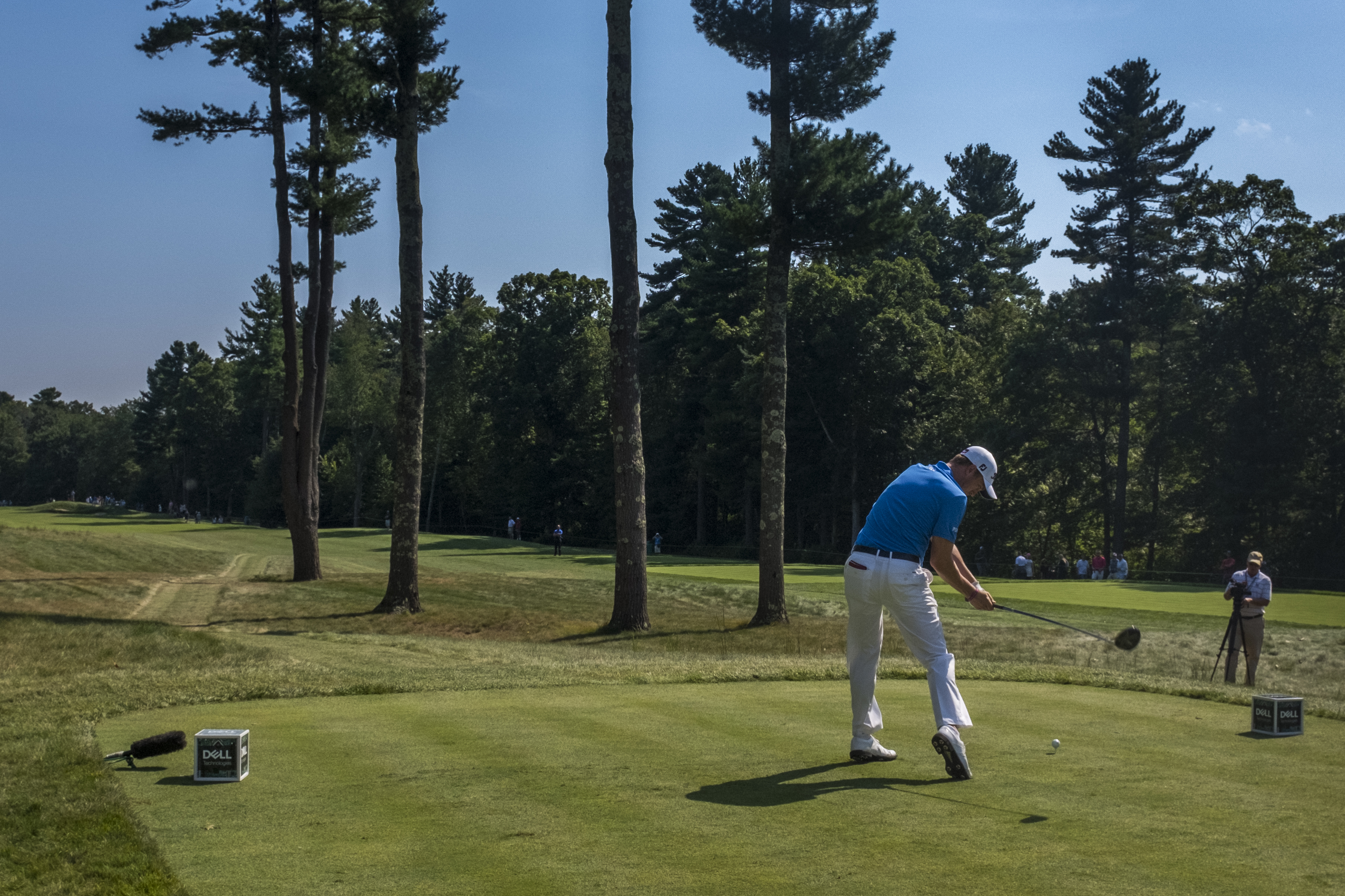 Thomas tees off on the sixth hole.