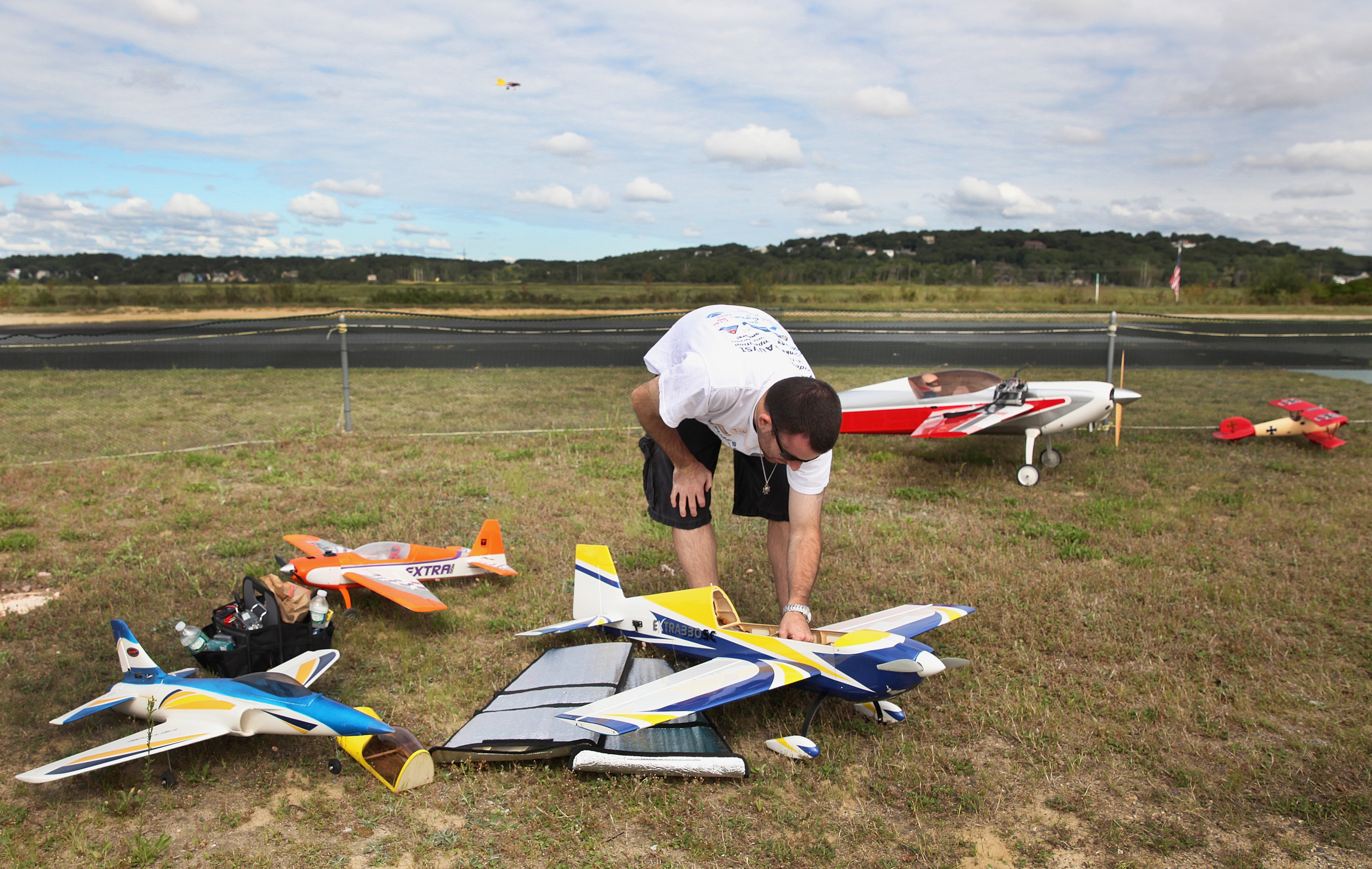 A variety of model aircraft surrounded member Matt Lordahl of Malden as he adjusted his plane’s radio-control receiver.