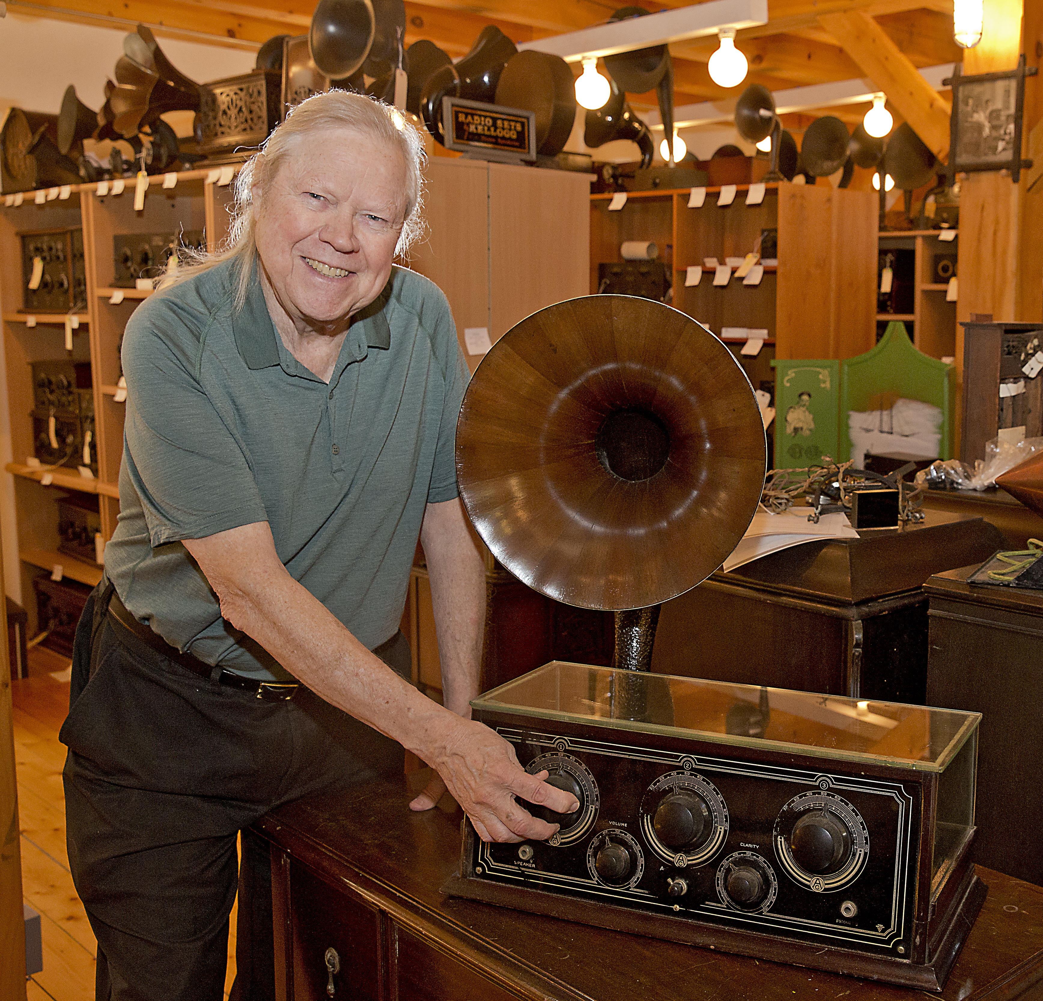 John Terrey in his Carlisle barn with a Kennedy Type XV, 5 tube radio from 1924.