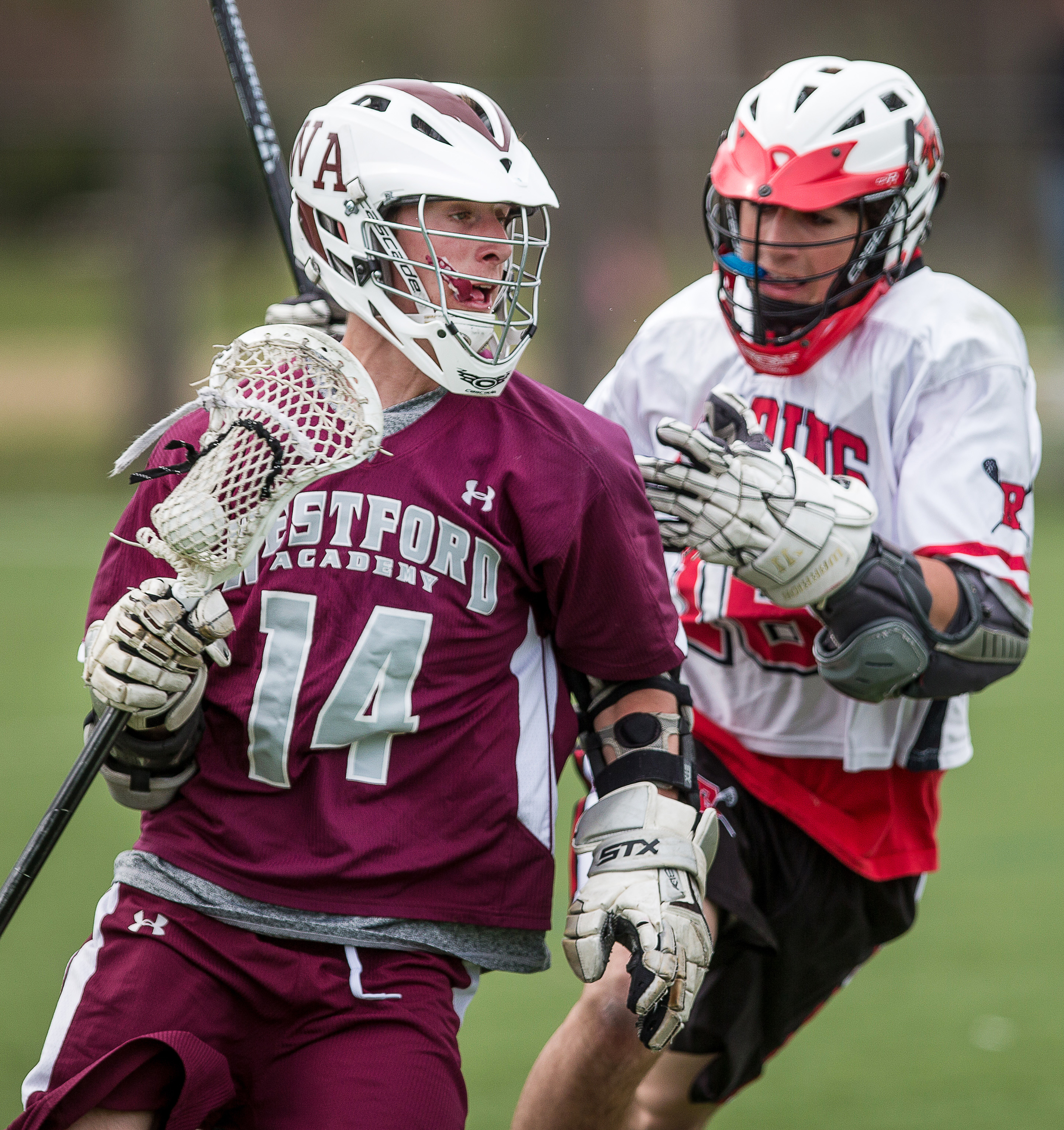 Westford Academy’s Jay Drapeau, who’s been asked to play a new team role, runs with the ball against Reading Saturday.