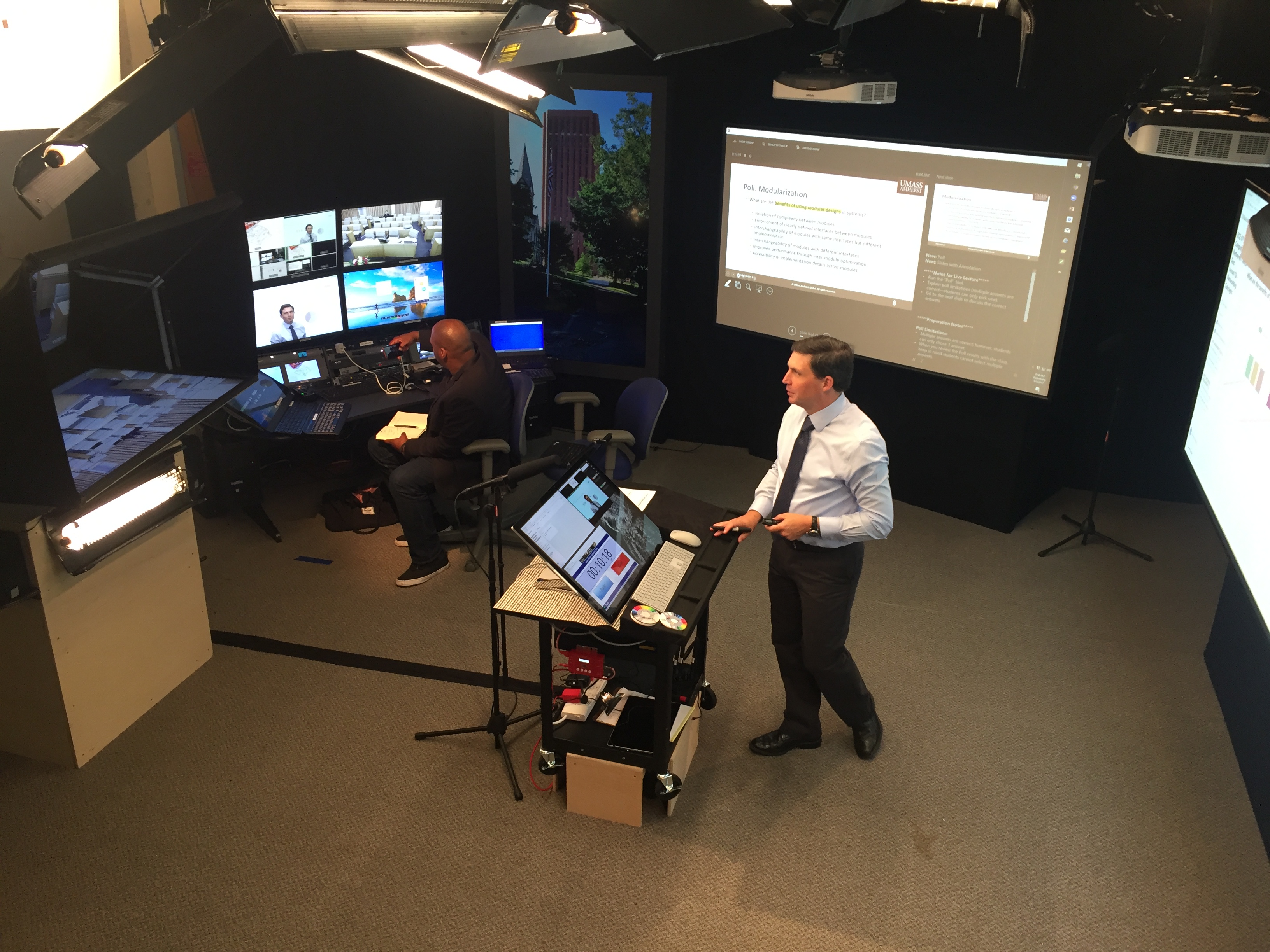 Tilman Wolf, a professor of electrical and computer engineering, teaches a class of graduate students in Shanghai from a new studio on the UMass Amherst campus.