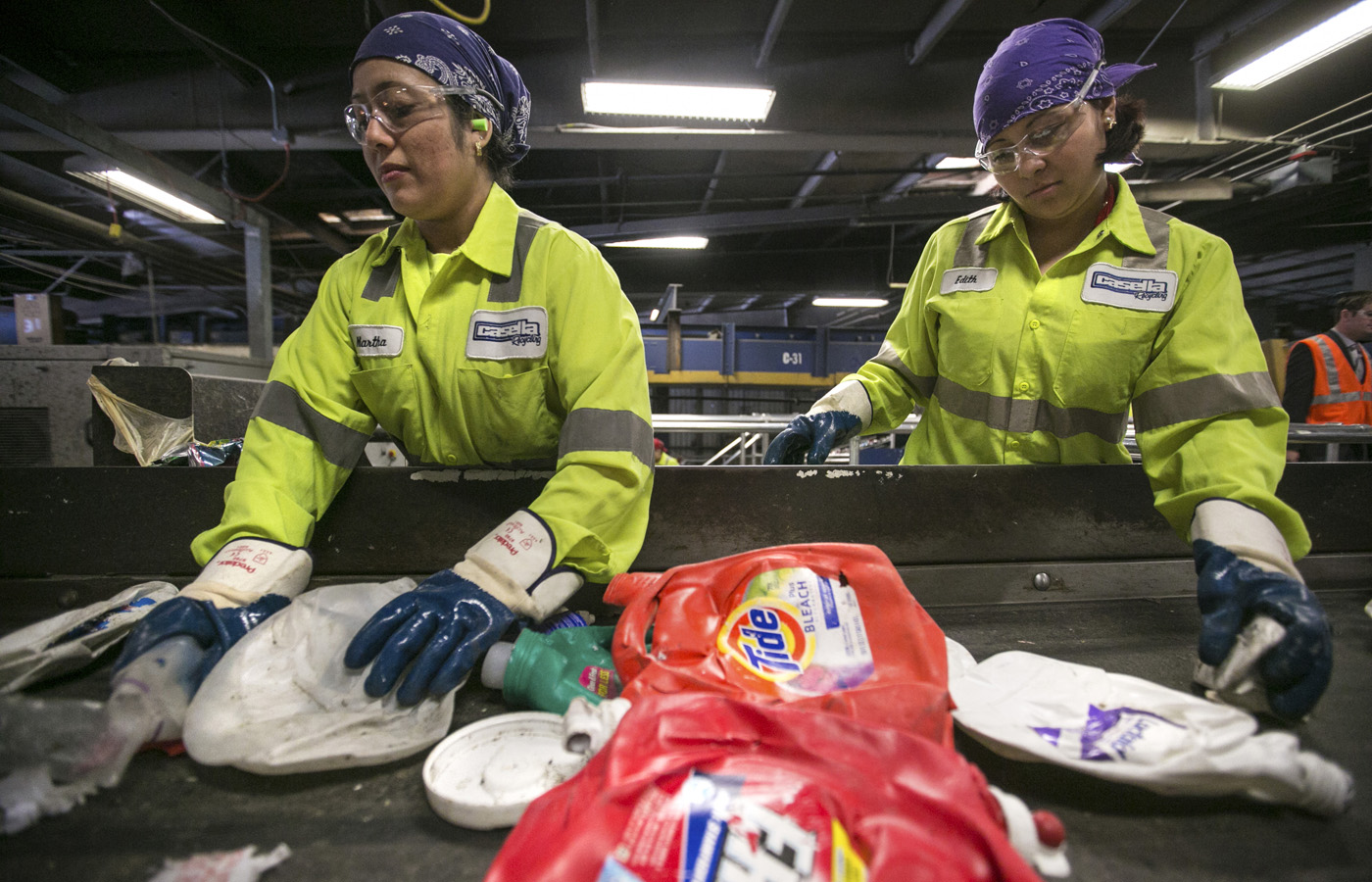 At Casella in Charlestown, the state’s biggest material recovery facility, workers pick out non-recyclables like Styrofoam from the mix.