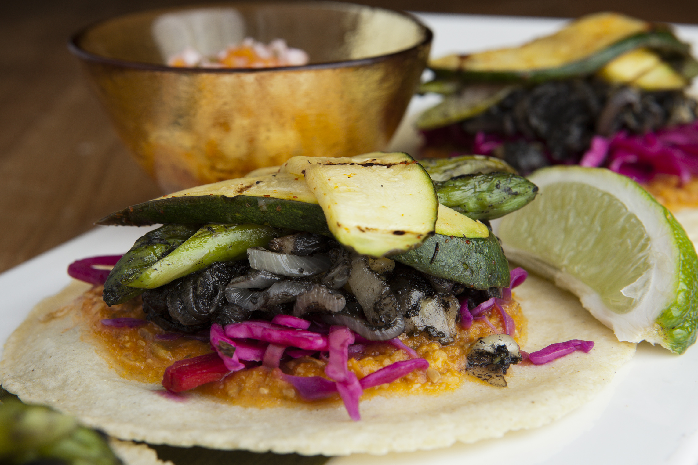Vegetarian tacos with roast zucchini, asparagus, huitlacoche, and pickled cabbage.