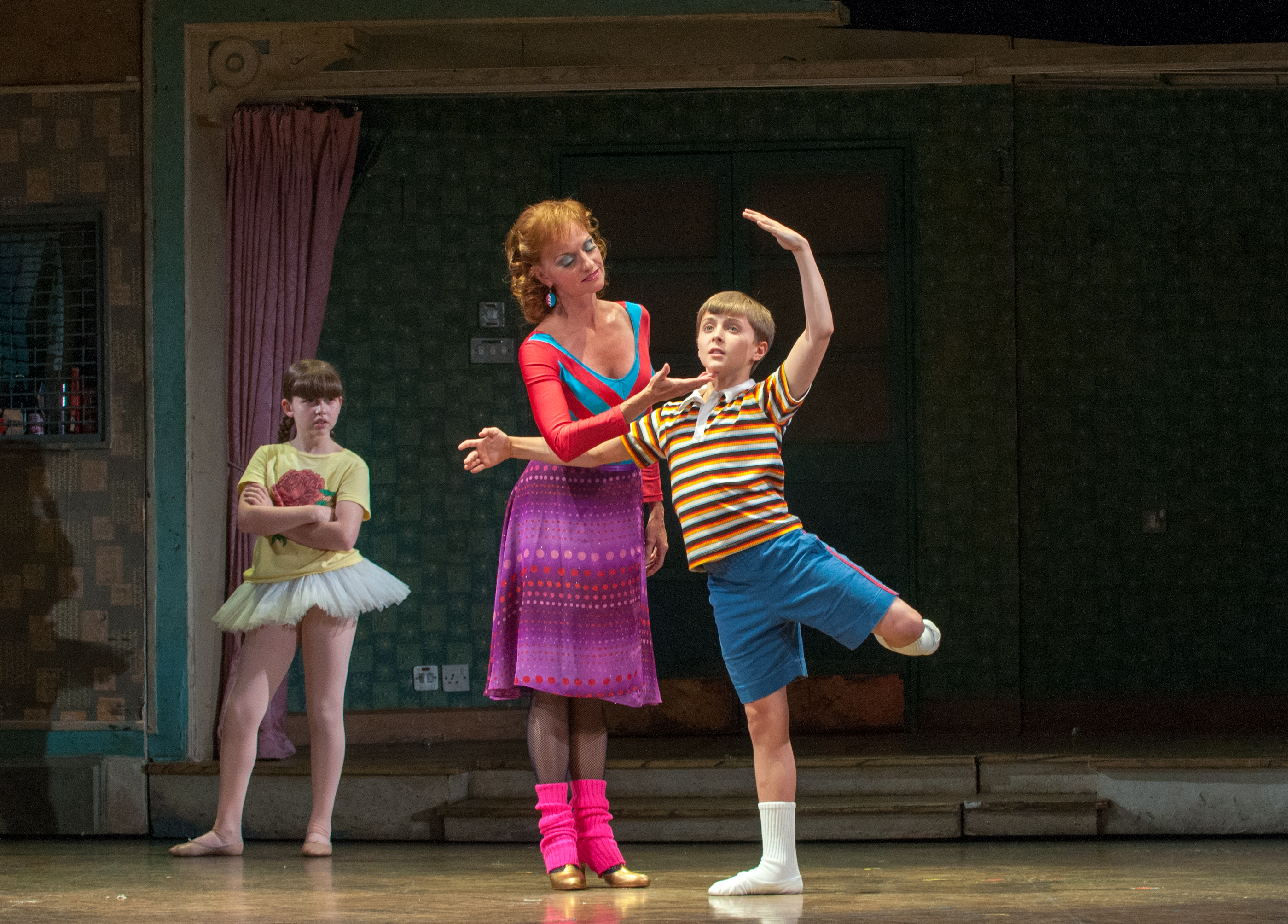 Noah Parets as Billy, Janet Dickinson as Mrs. Wilkinson, and Samantha Blaire Cutler as Debbie in "Billy Elliot: The Musical."