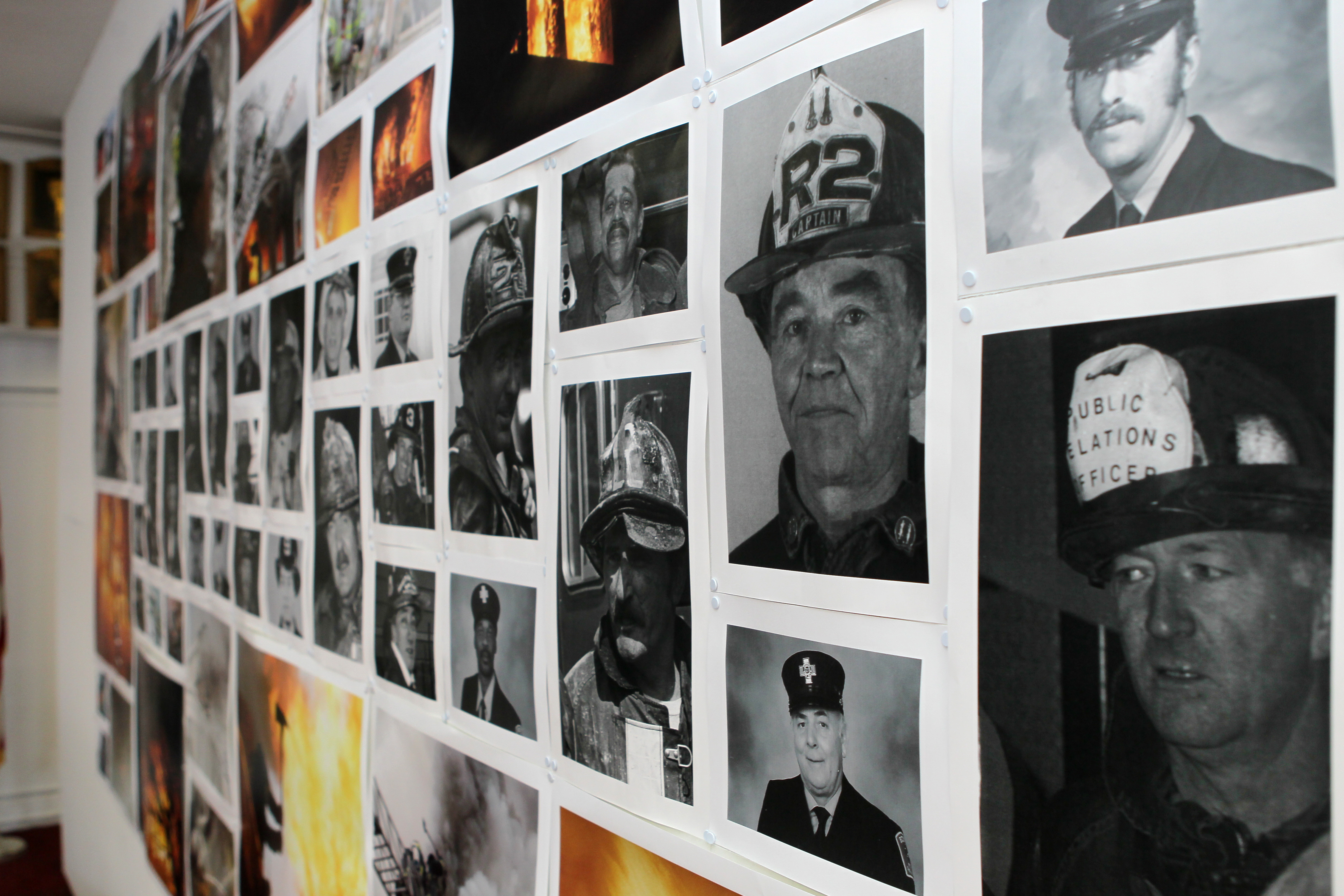 Pictures of firefighters who died of cancer hung on a wall at Boston Fire Department headquarters.