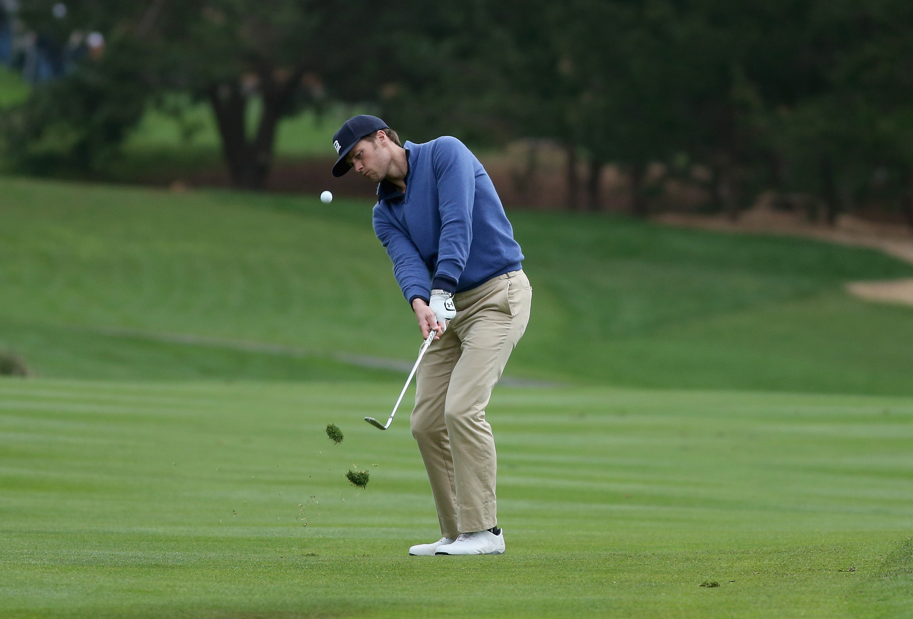 Tom Brady, an avid golfer, pitched onto the 13th green during the third round of the AT&T Pebble Beach National Pro-Am in February 2014 in Pebble Beach, Calif.