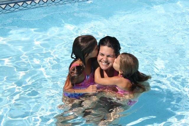 Melanie Feehan enjoyed time last summer in the family’s pool in Plymouth, with daughters Shannon (left), 11, and Leela, 10.