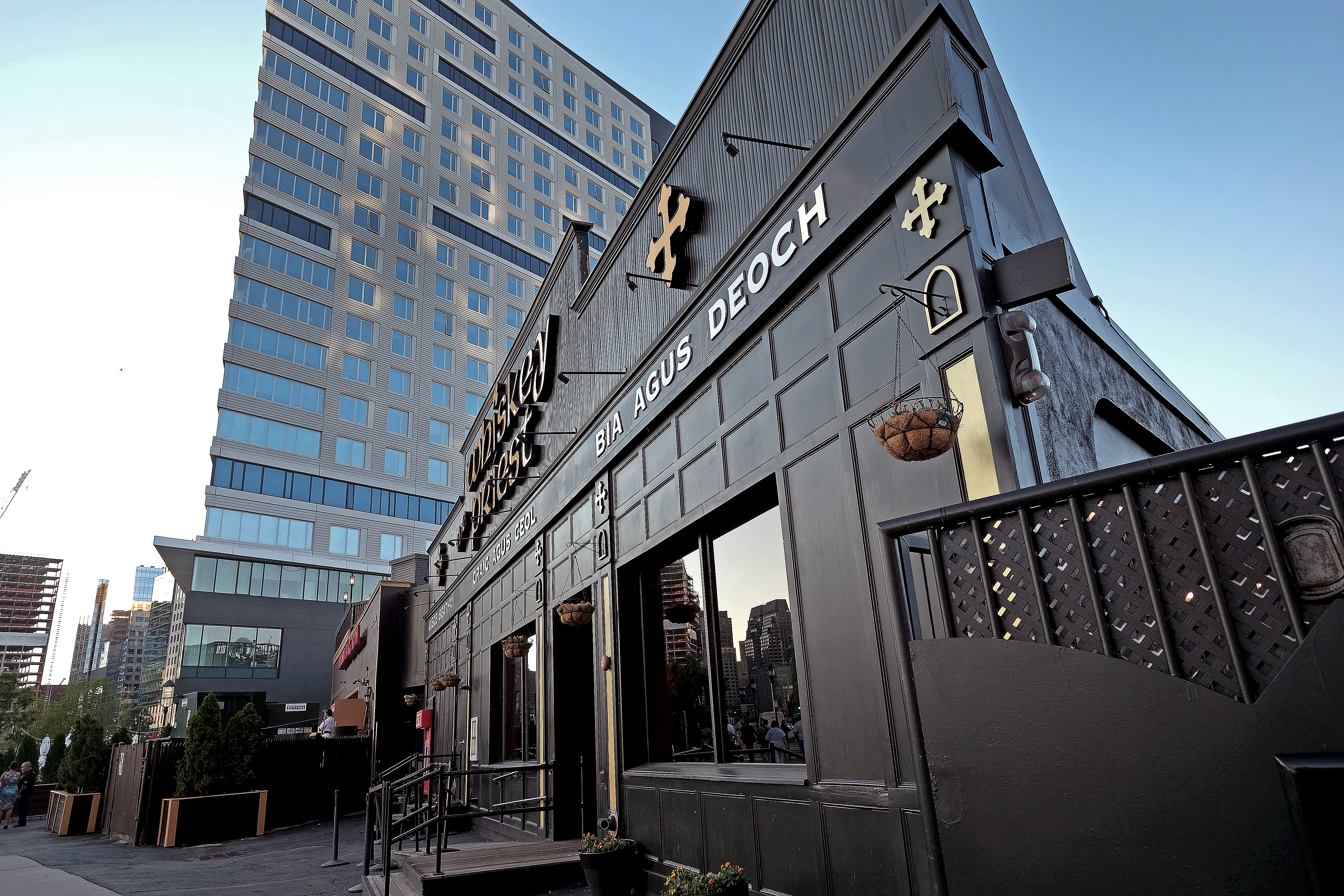 The Conservation Law Foundation is planning to sue the developer of a 22-story tower where the Whiskey Priest and Atlantic Beer Garden are located.