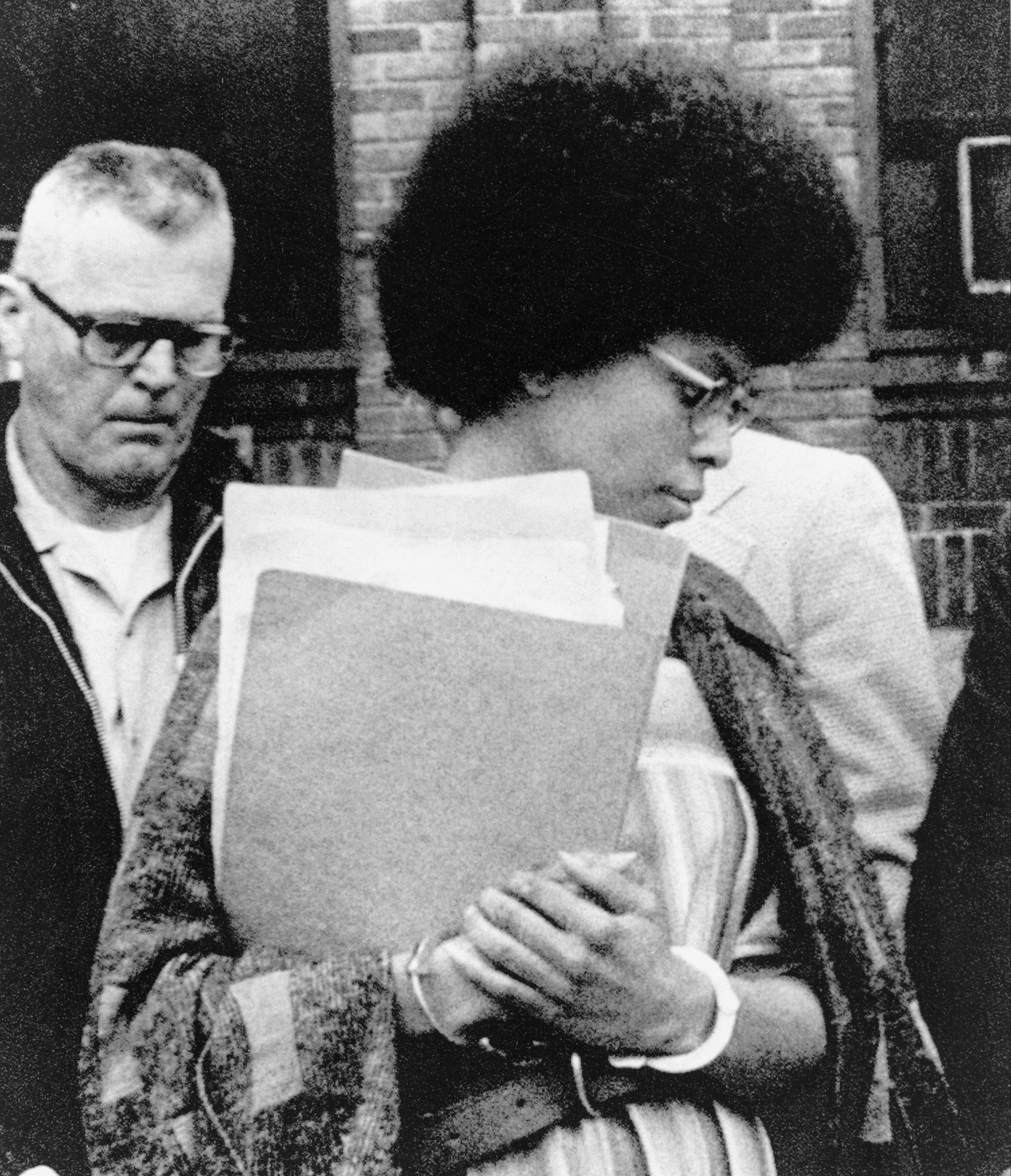 In April 1977, Joanne Chesimard left court in New Jersey. Now known as Assata Shakur, she is considered a fugitive and has been living in Cuba since the 1980s.