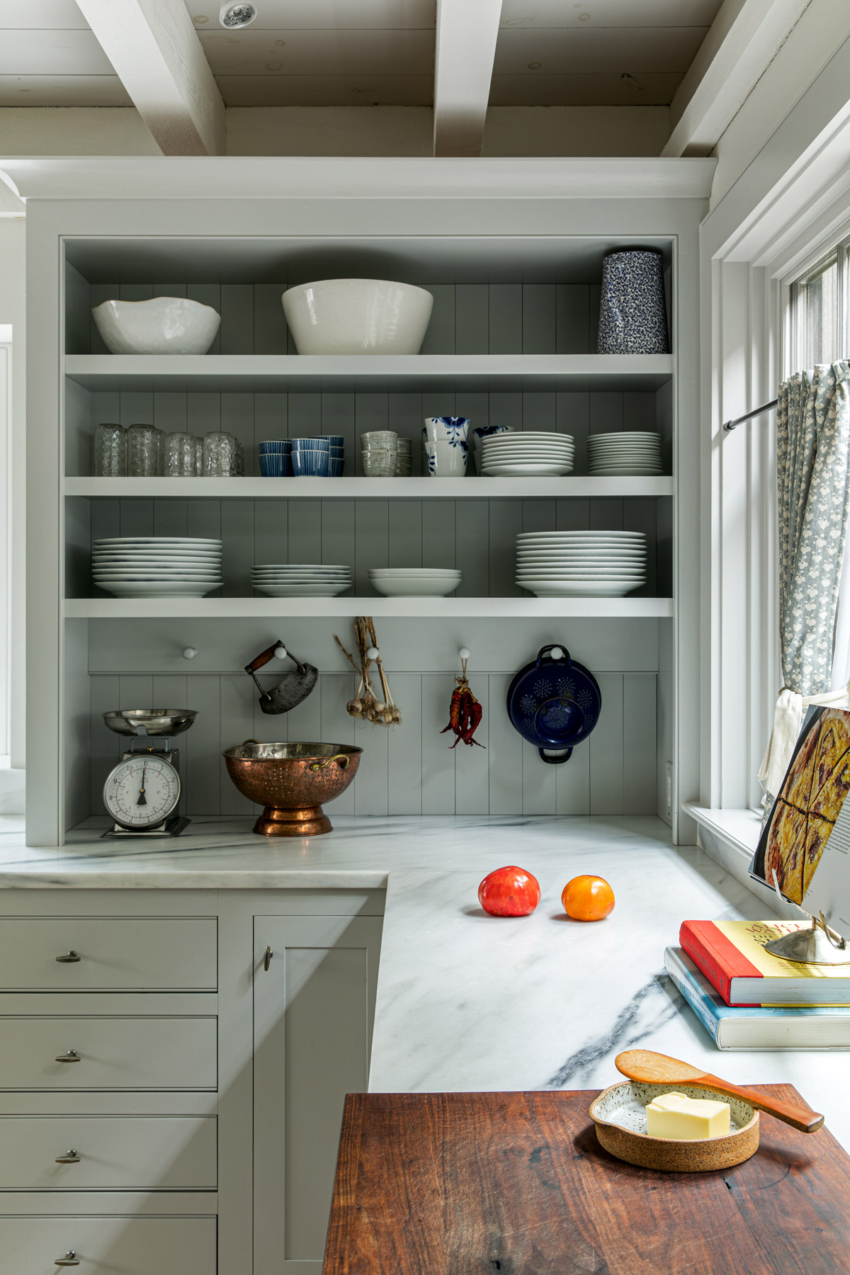 The cabinetry and shiplap are painted in Sherwin-Williams Evening Shadow. The curtain fabric is from Rogers & Goffigon Ltd.