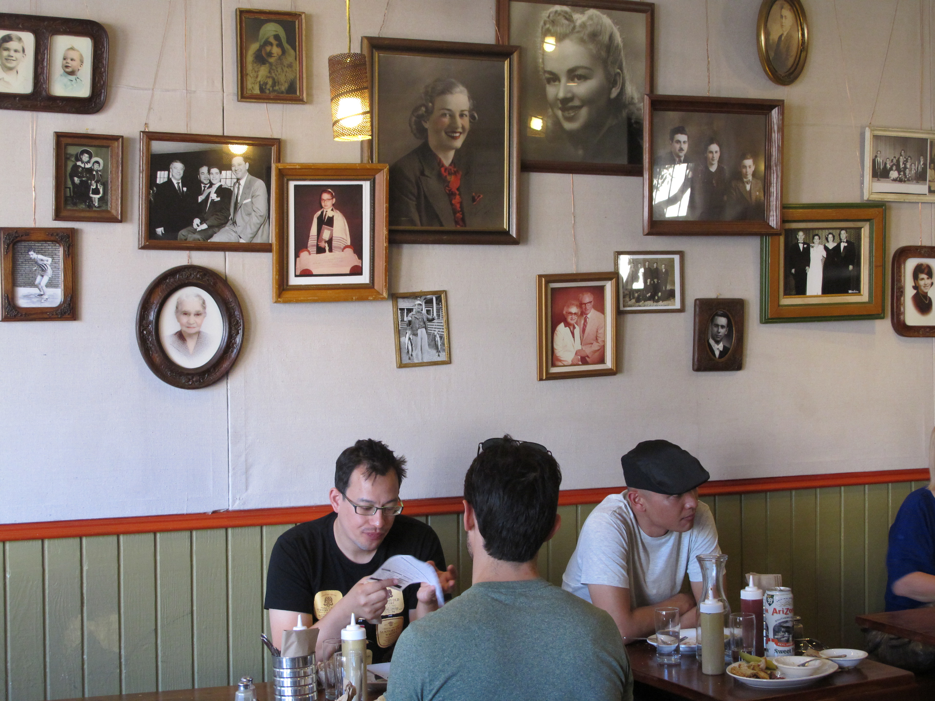 The walls at Wise Sons Delicatessen are covered with photographs of ancestors of co-owners Leo Beckerman and Evan Bloom. Customers order at the register off a menu board, then find a table and wait for the meal to arrive. Many bring recipes, “always for the ‘best’ challah or kugel,” says Bloom.