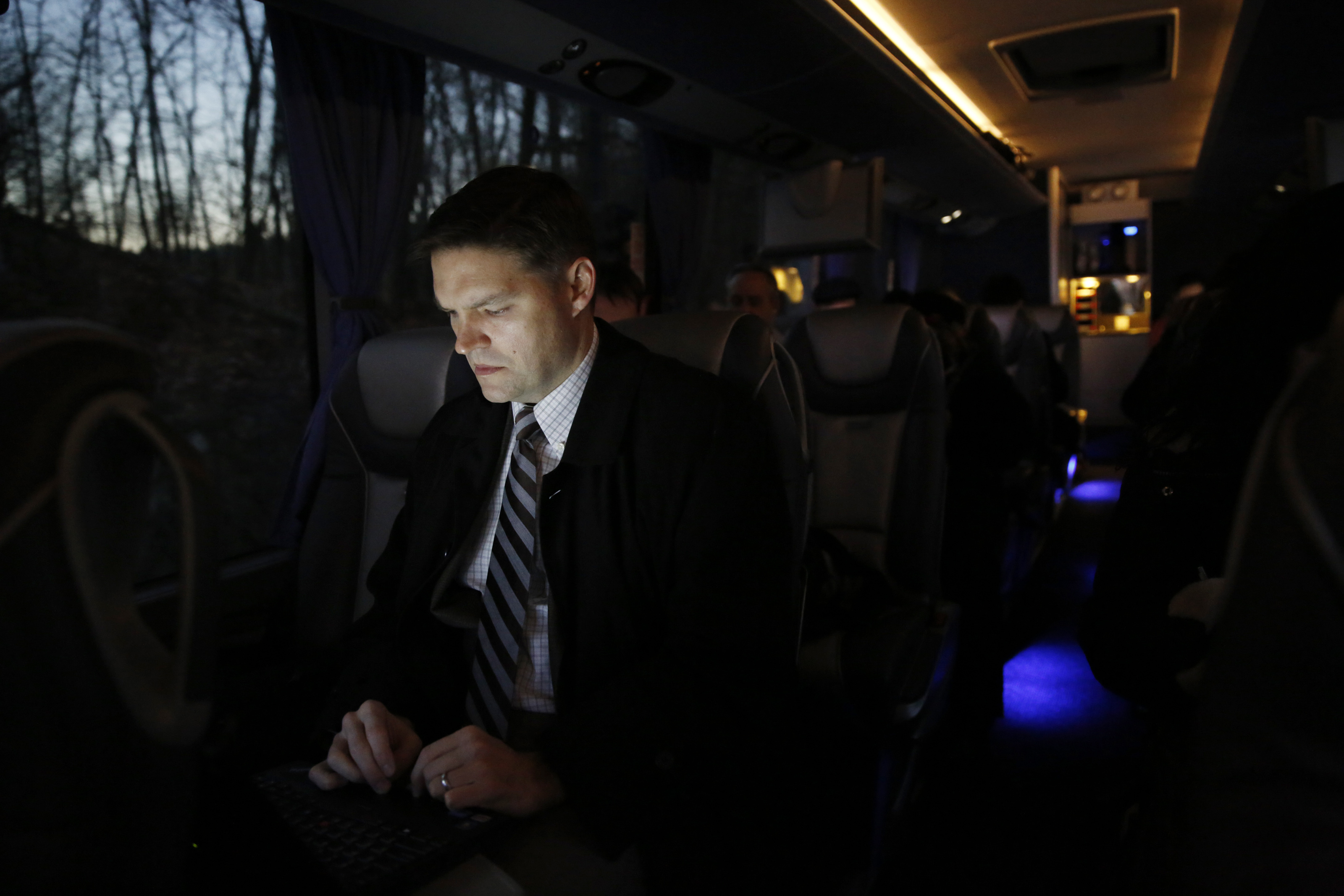 Troy Morgan works on his laptop aboard the Biogen Bus that shuttles employees between the Weston Biogen campus and Cambridge Biogen campus.