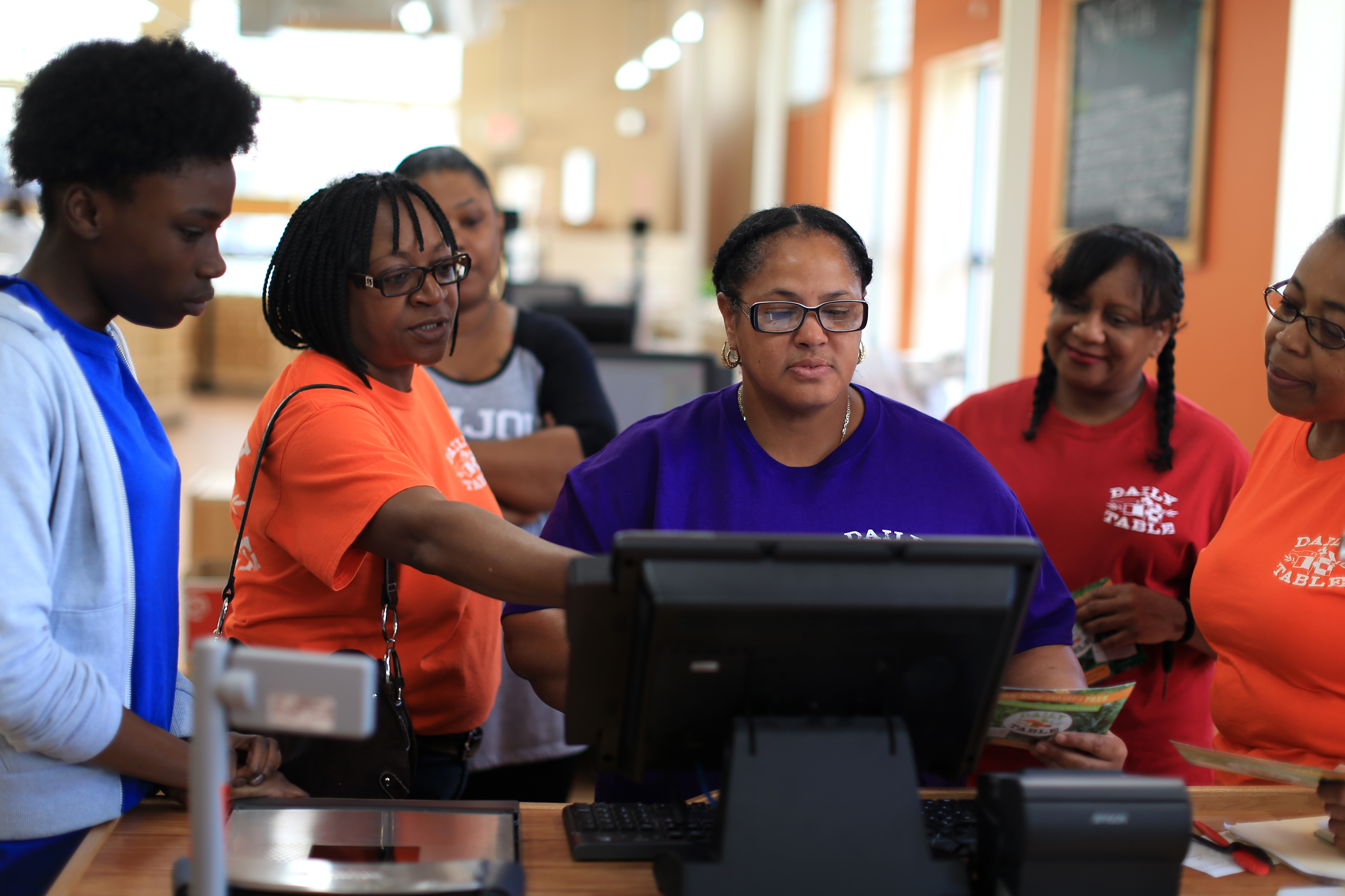 Customer service supervisor Angelina Latimore (second from left) trained new staff this week.