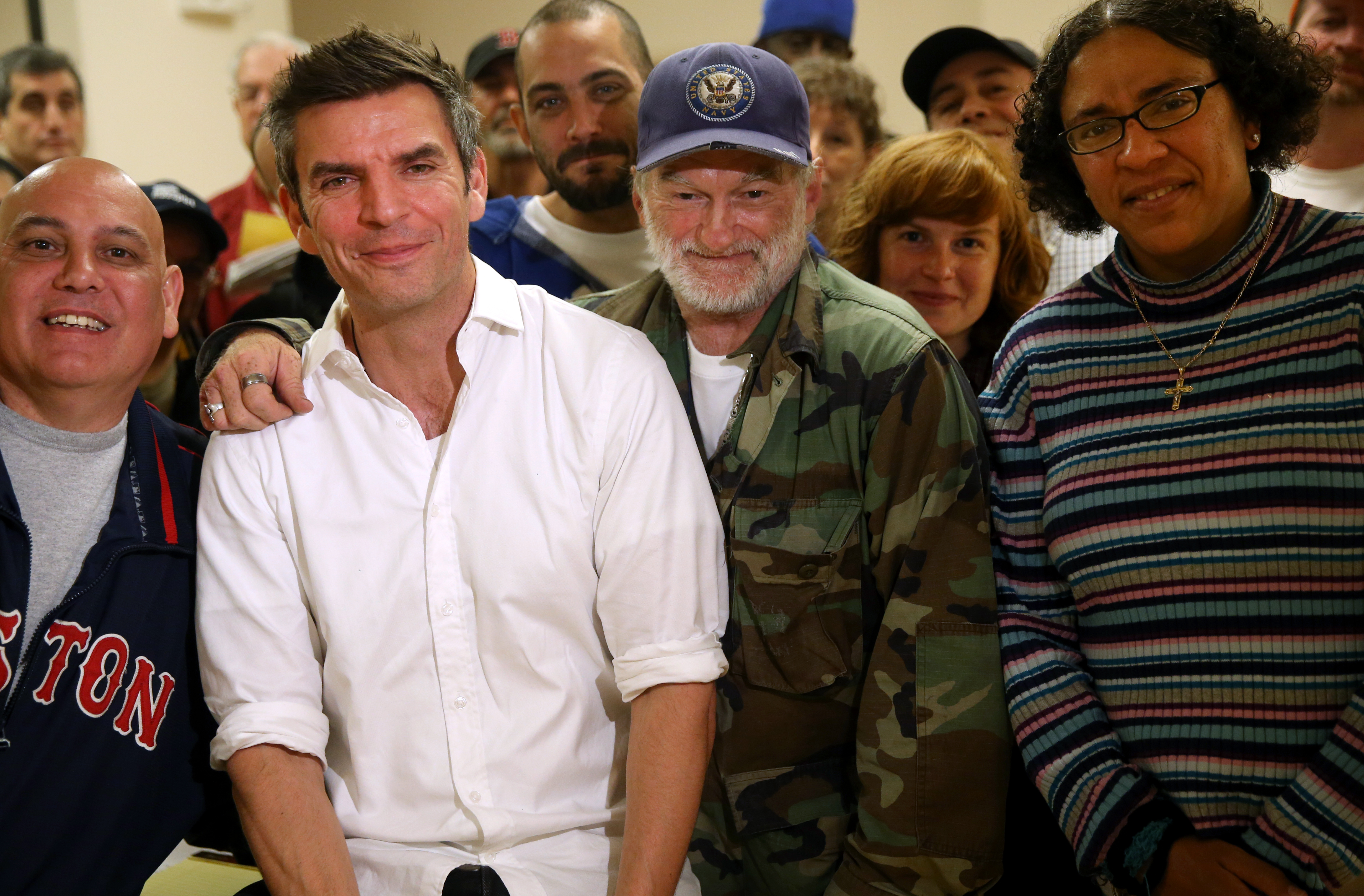 Front row, from left: writer Joseph Haddad, James Parker, and writers Bryant Draycott and Sabrina Davis. Back row, from left: Lizine and volunteer Kate Glavin, from UMass Boston.