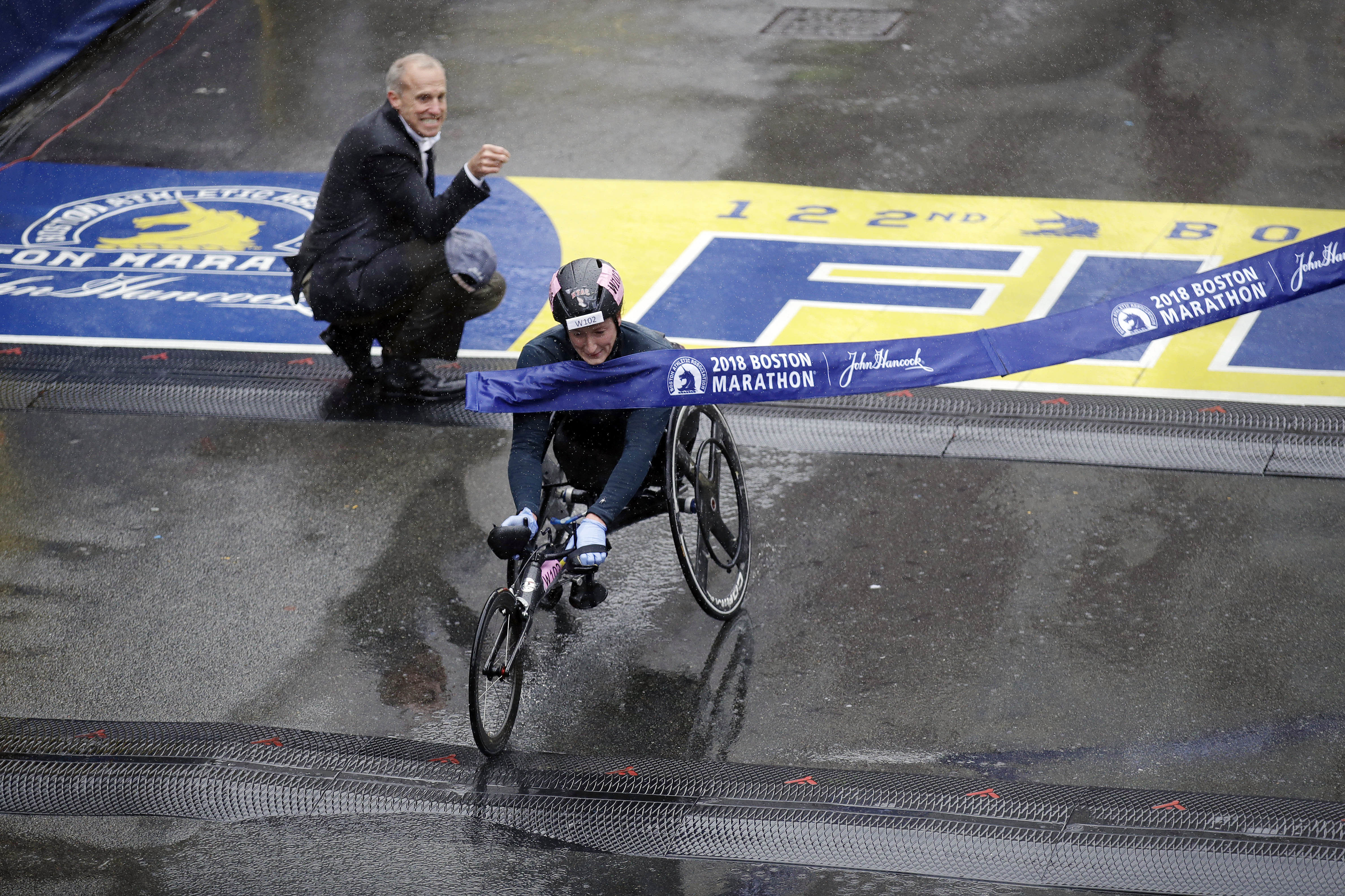 Tatyana McFadden breaks the tape, sealing her victory.