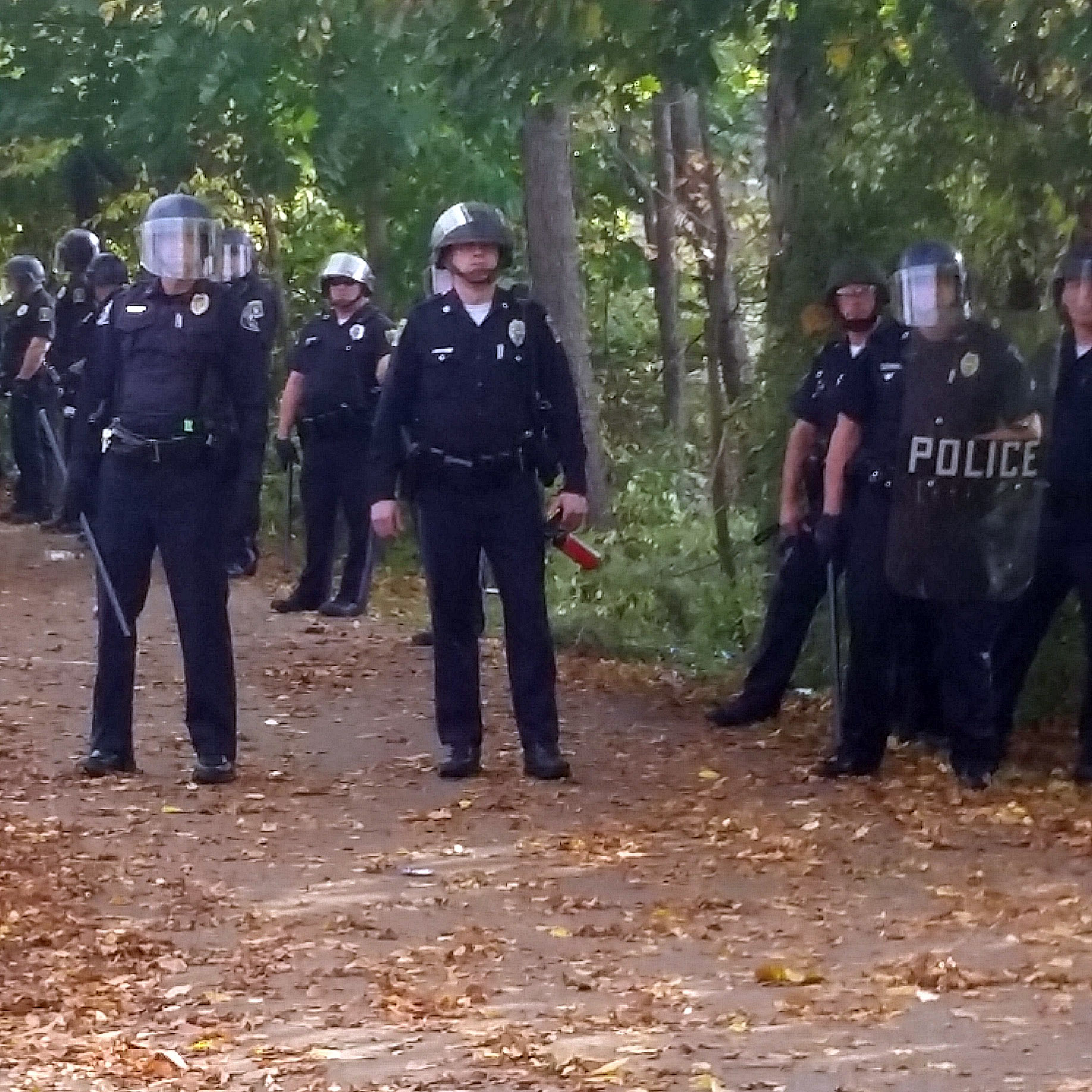 Local police lined up in response to large crowds as the Pumpkin Festival near Keene State College in New Hampshire got underway Saturday.