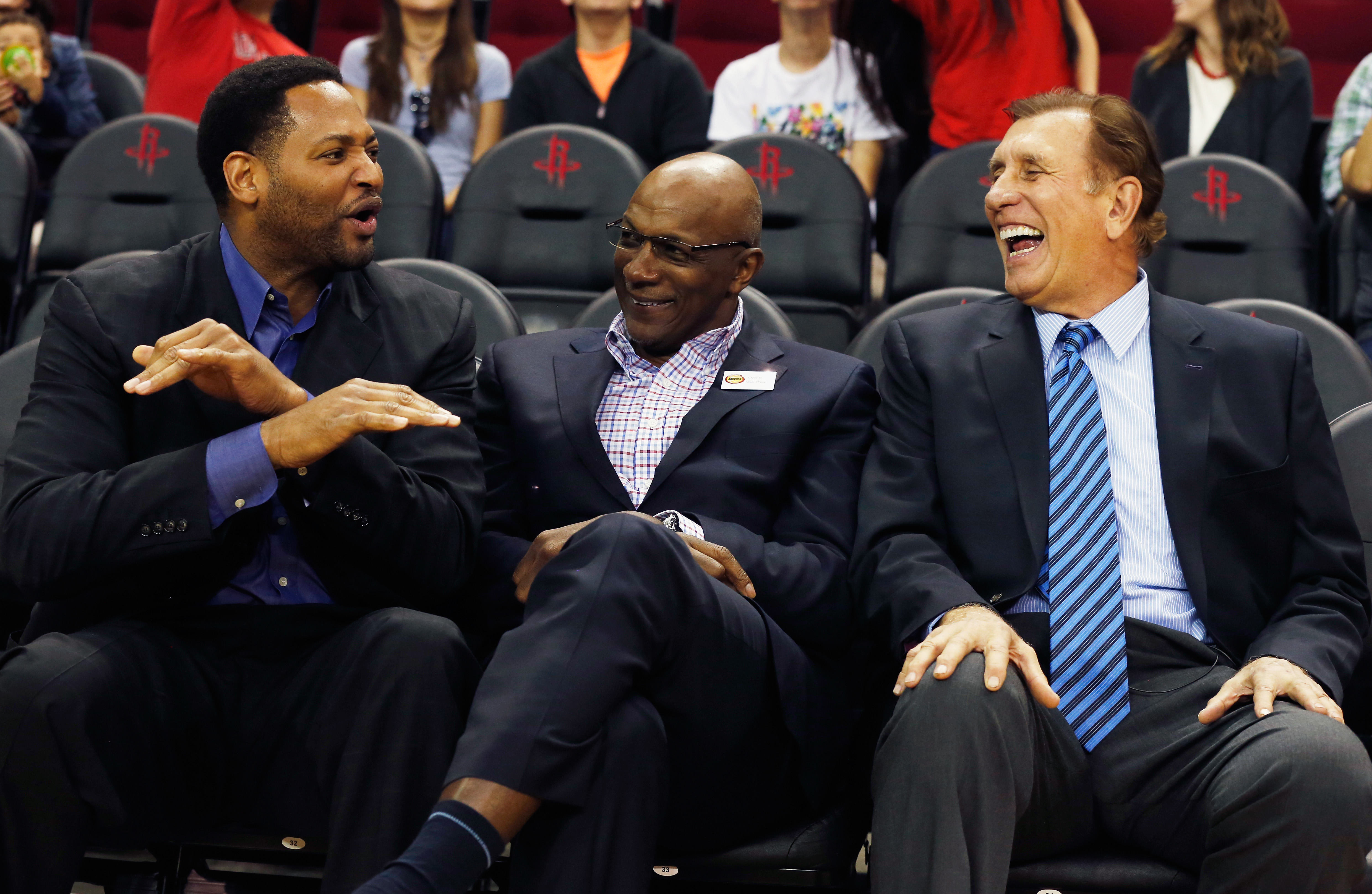 Fomer Houston Rockets Robert Horry (left) and Clyde Drexler shared a laugh with former coach Rudy Tomjanovich as the team honored the 20th anniversary of back-to-back championships last March.