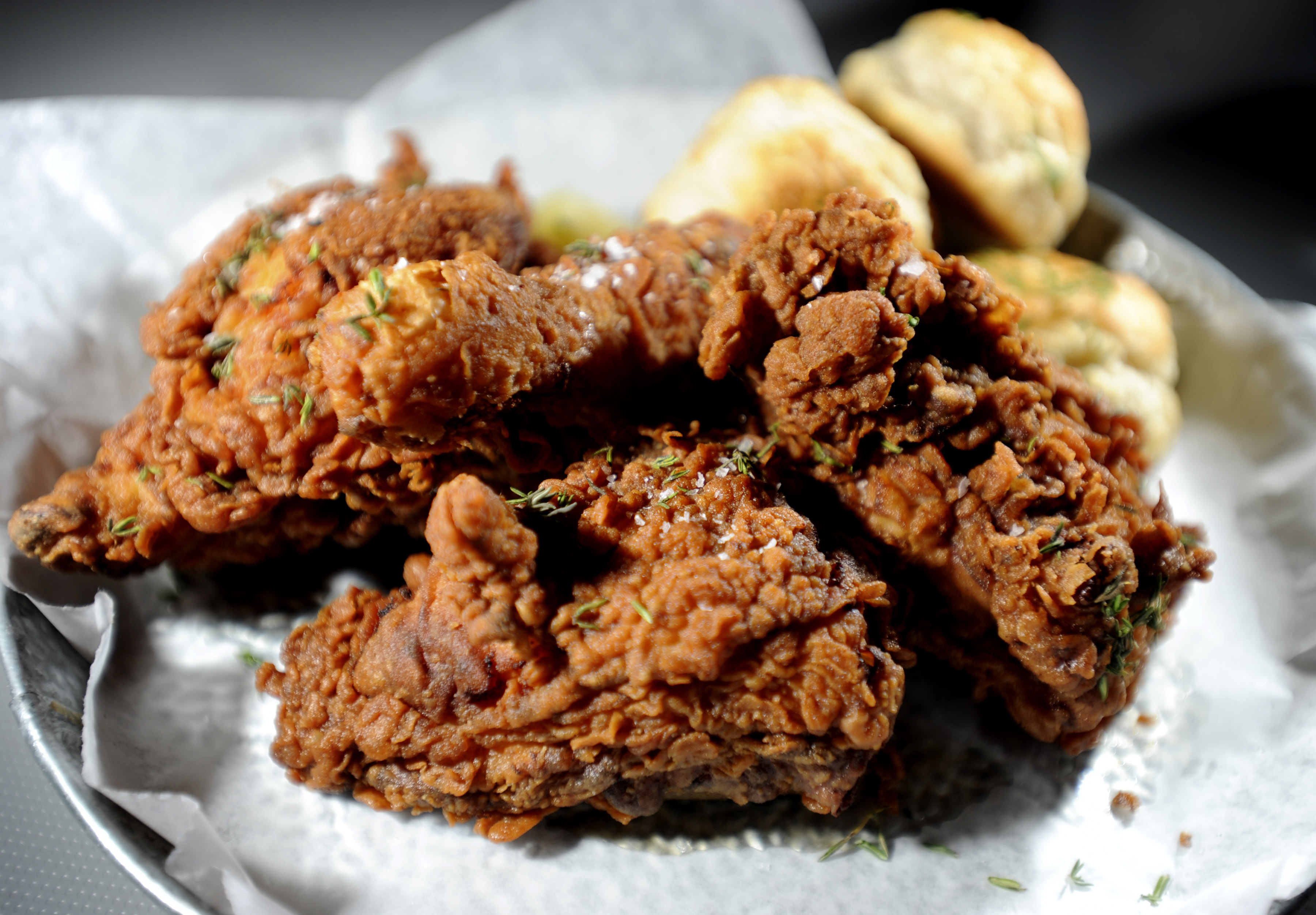Fried chicken served with biscuits and slaw.
