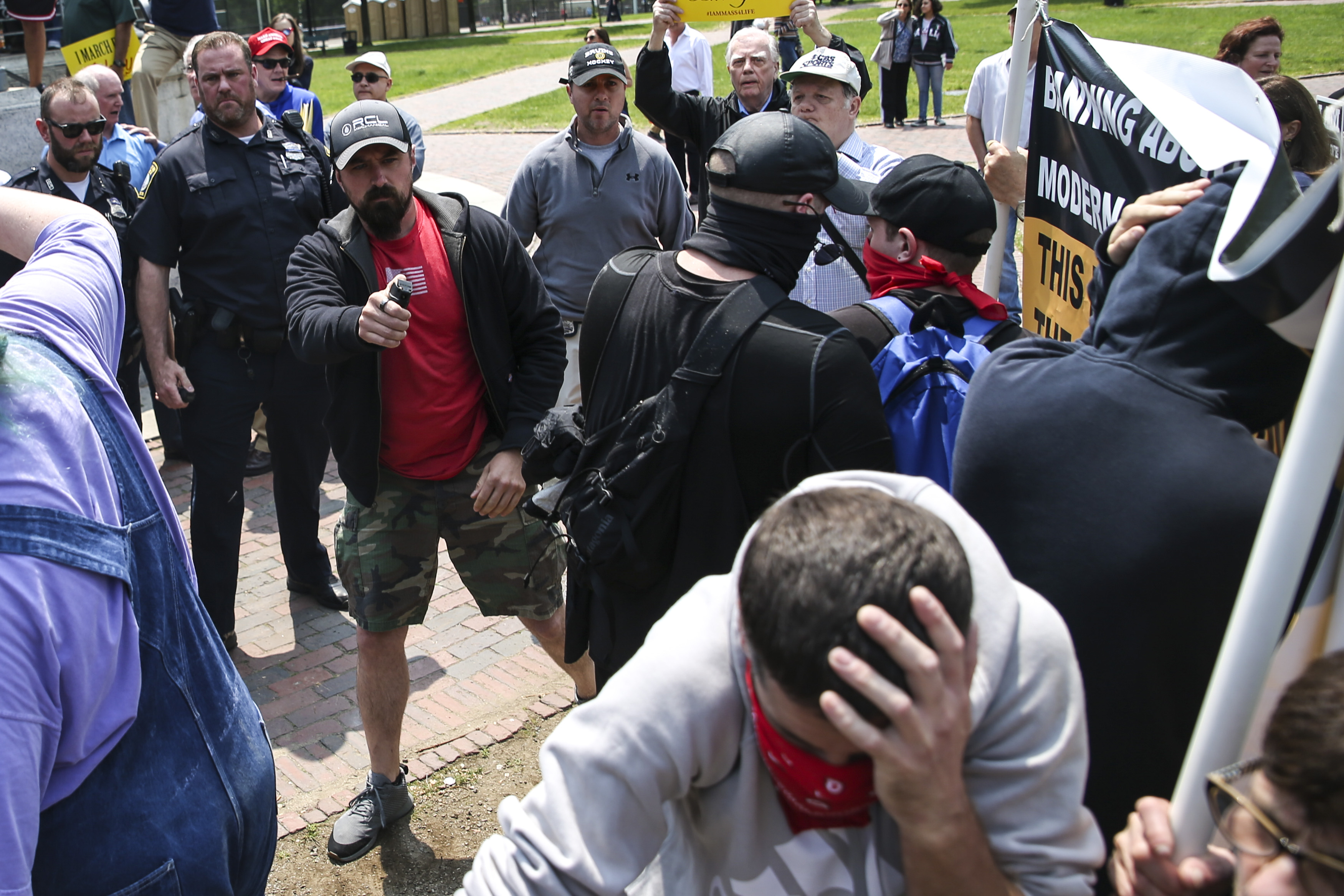 An undercover police officer deployed pepper spray into the crowd after a clash between protesters and an anti-abortion rally.