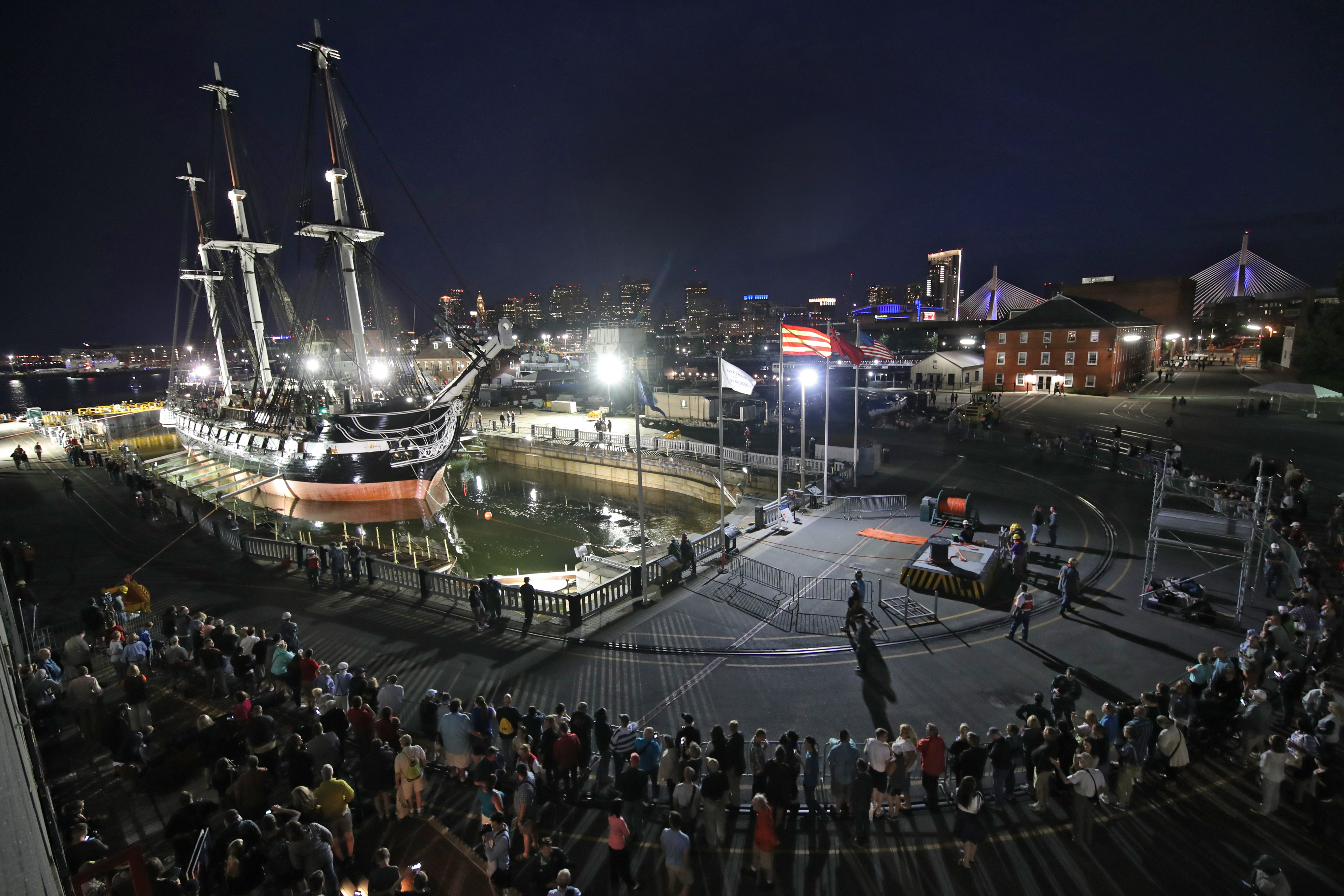 Just before 9:45 p.m., a sailor shouted, “The boat has floated!” Above: A crowd surrounded the ship Sunday night.