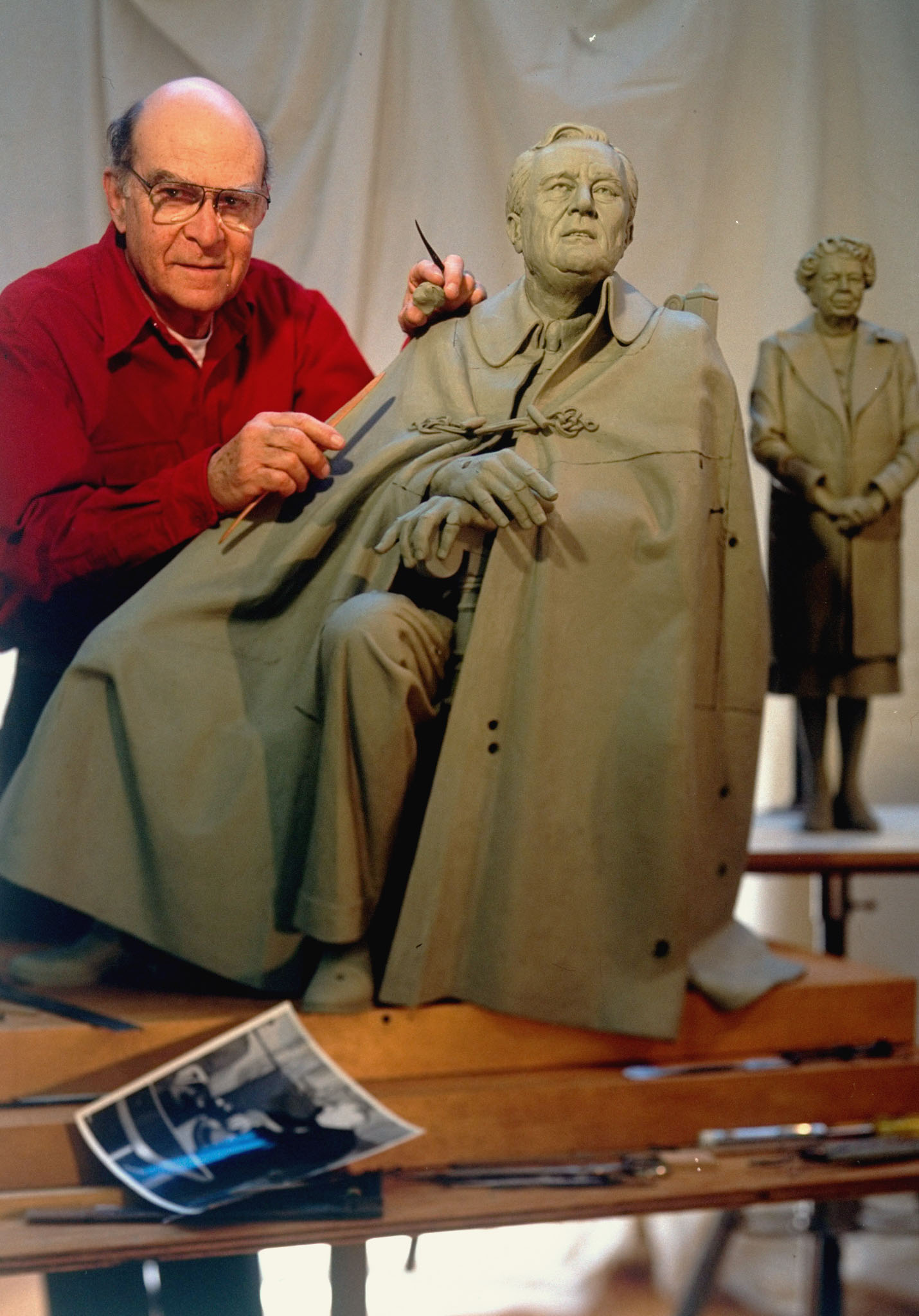 Mr. Estern with scale models of his statues of President Franklin D. Roosevelt and Eleanor Roosevelt.