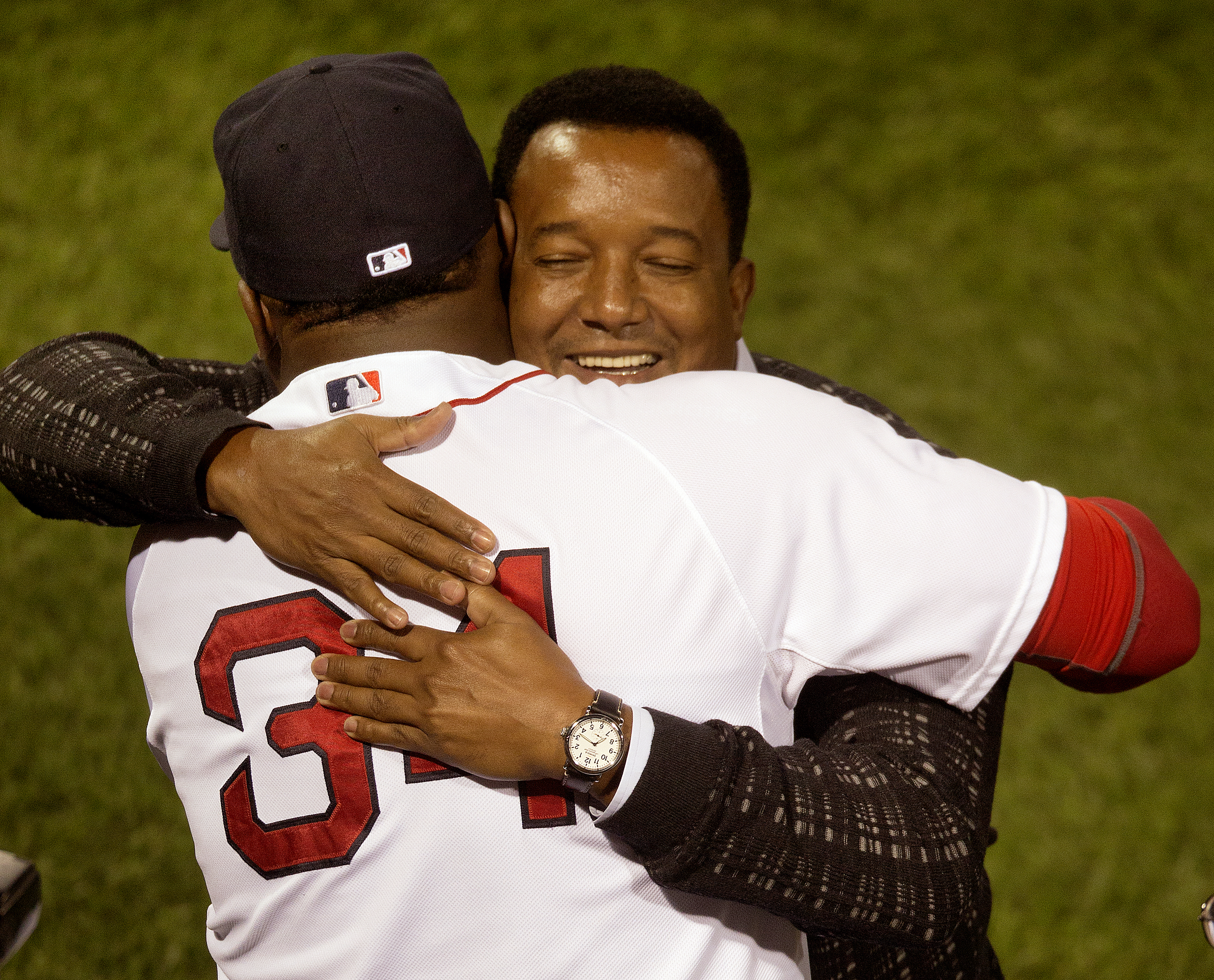 Hall of Famer Pedro Martinez hugged former teammate David Ortiz at a Fenway Park ceremony to honor Ortiz after he hit his 500th home run.