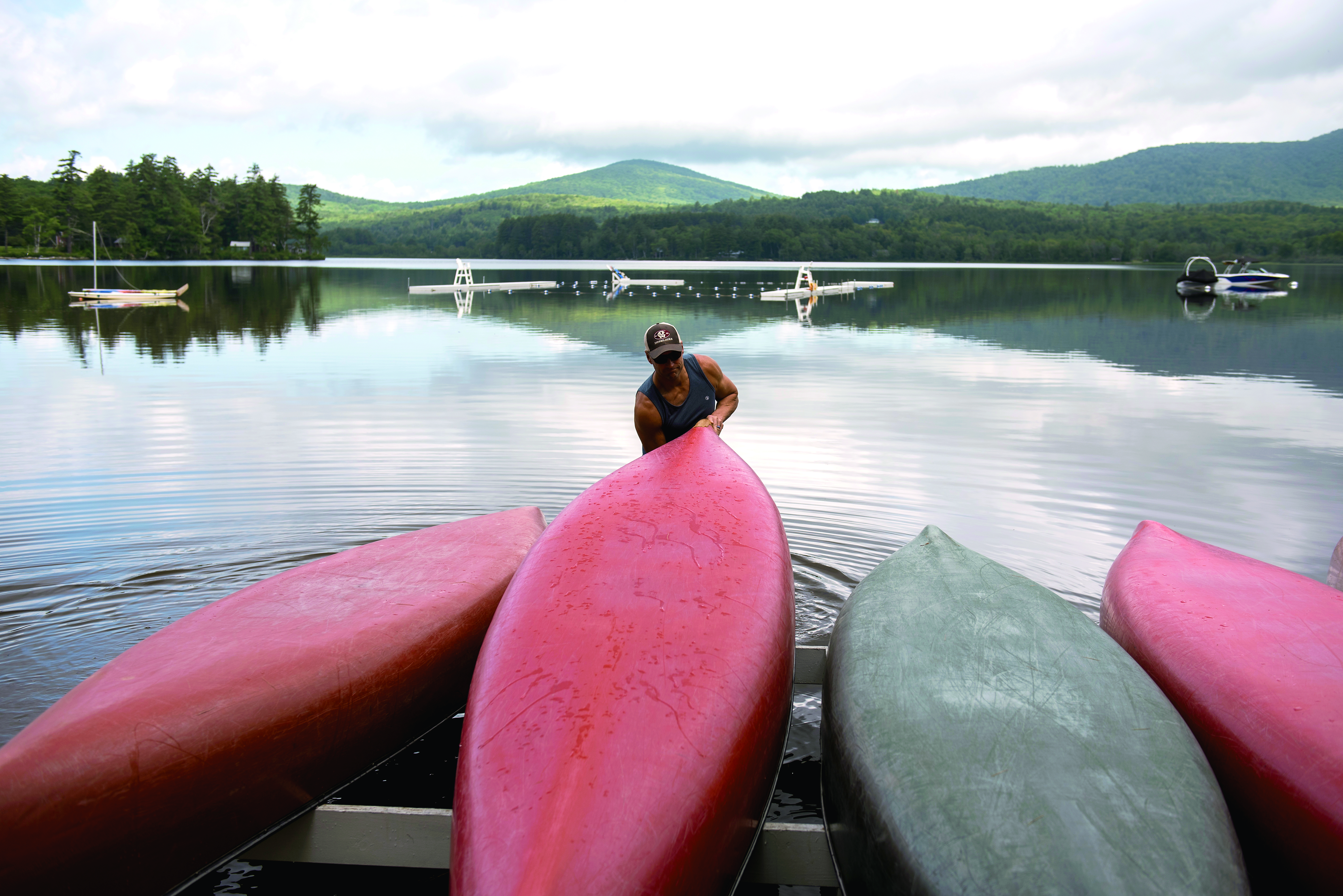 Bill McMahon flipped a canoe before taking campers out.