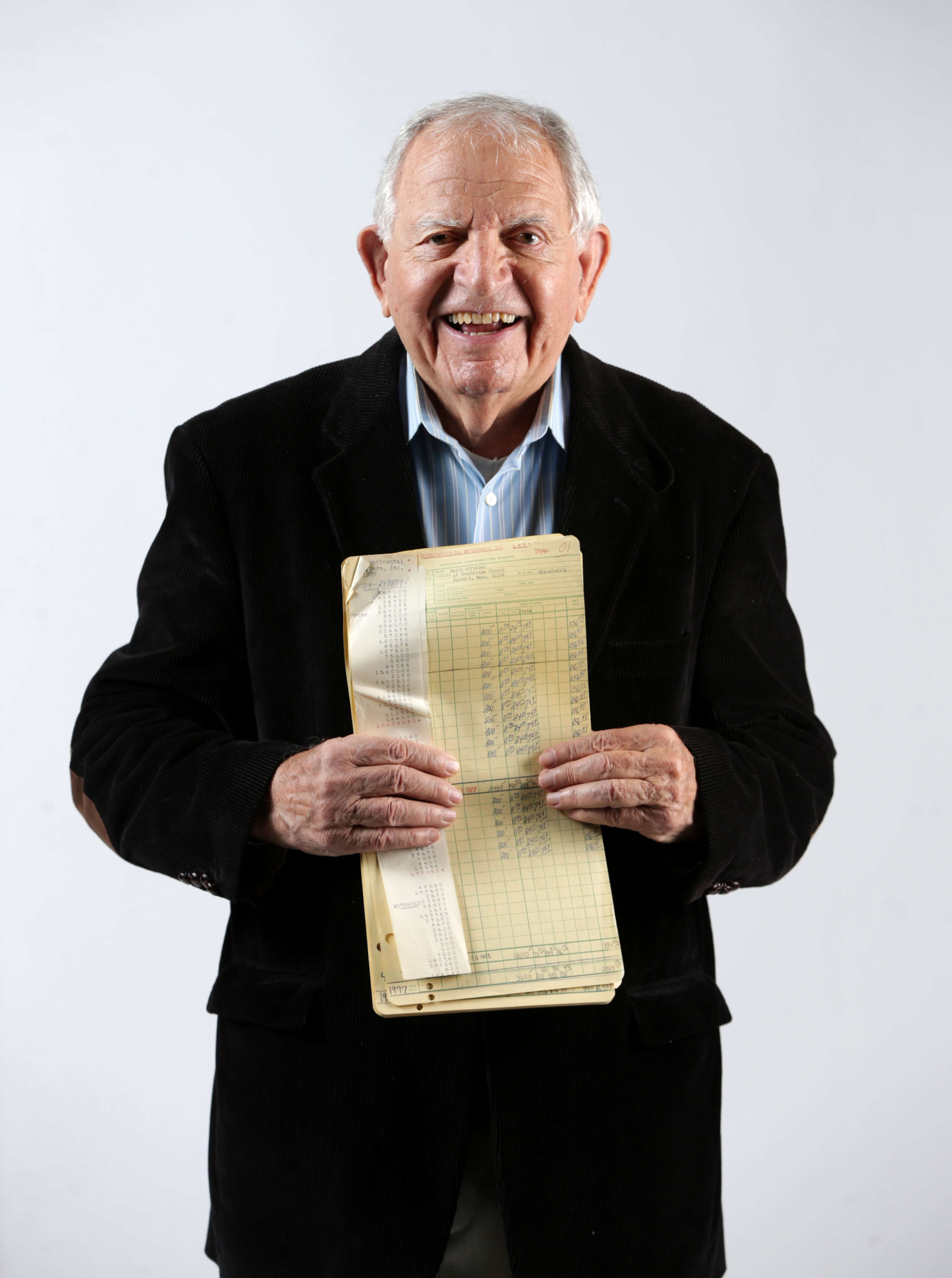 Boston Ma 10132016 I love My Job Subject Marty Panos (cq) of International RE. He is photographed for TPTW Boston Globe Magazine Edition. He is holding a old payroll ledger that was hand written. Boston Globe Staff/Photographer Jonathan Wiggs