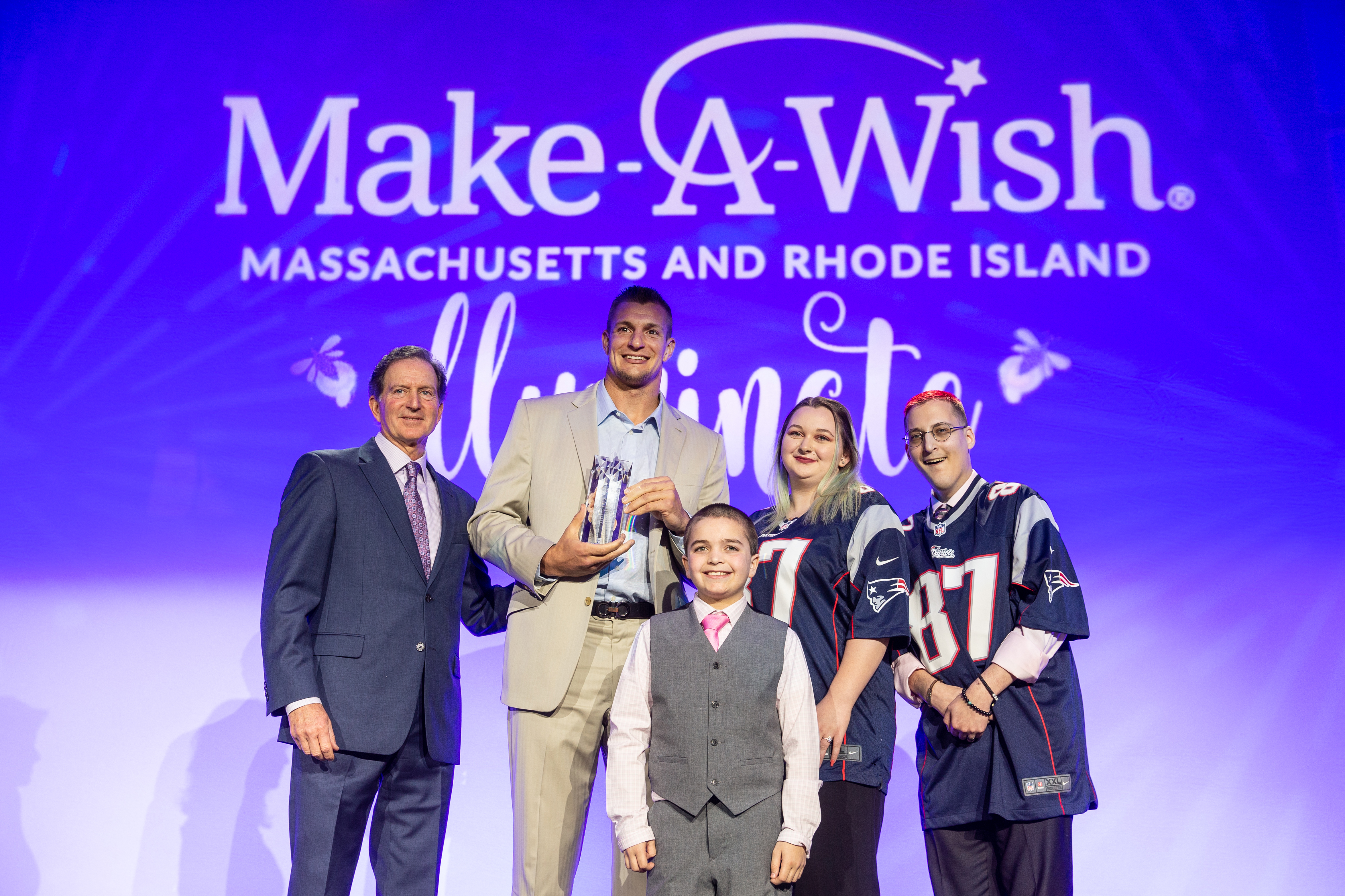 Jay Mattie, Rob Gronkowski, and wish kids Ryan, Jordyn, and Cole posed for a photo.