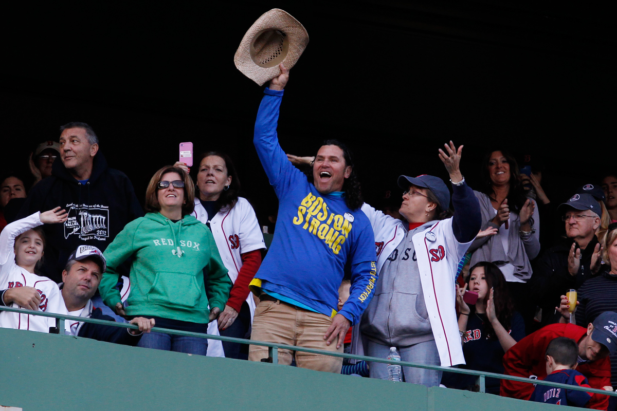 Carlos Arredondo stood and cheered at the start of the Red Sox World Series parade at Fenway Park. He has become the face of Boston Strong.