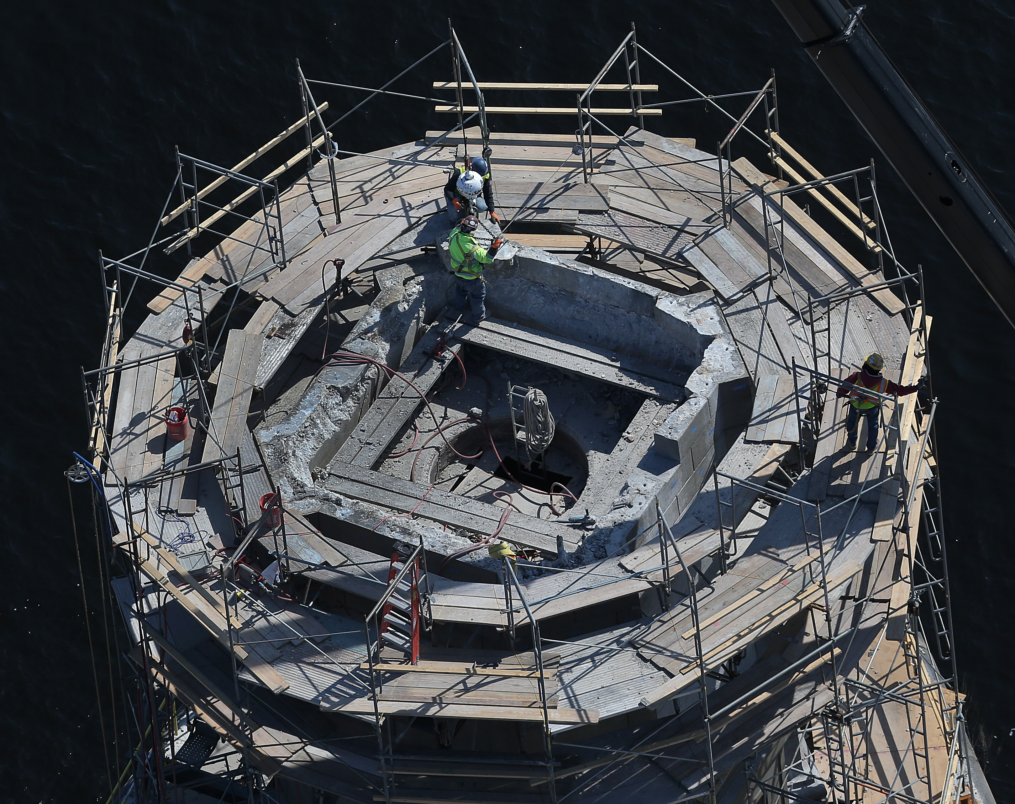 Crews worked on one of the bridge’s salt-and-pepper shaker towers” in March 2014.