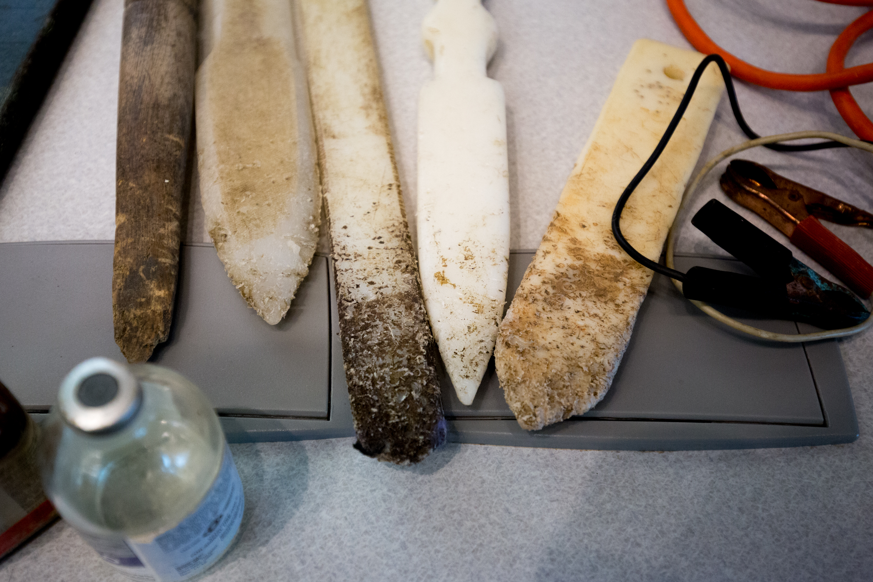 Plastic sticks used to release a fighting dog’s bite, bottles of drugs used to improve performance, and electric clamps to kill defeated animals sat on a table during the lecture.