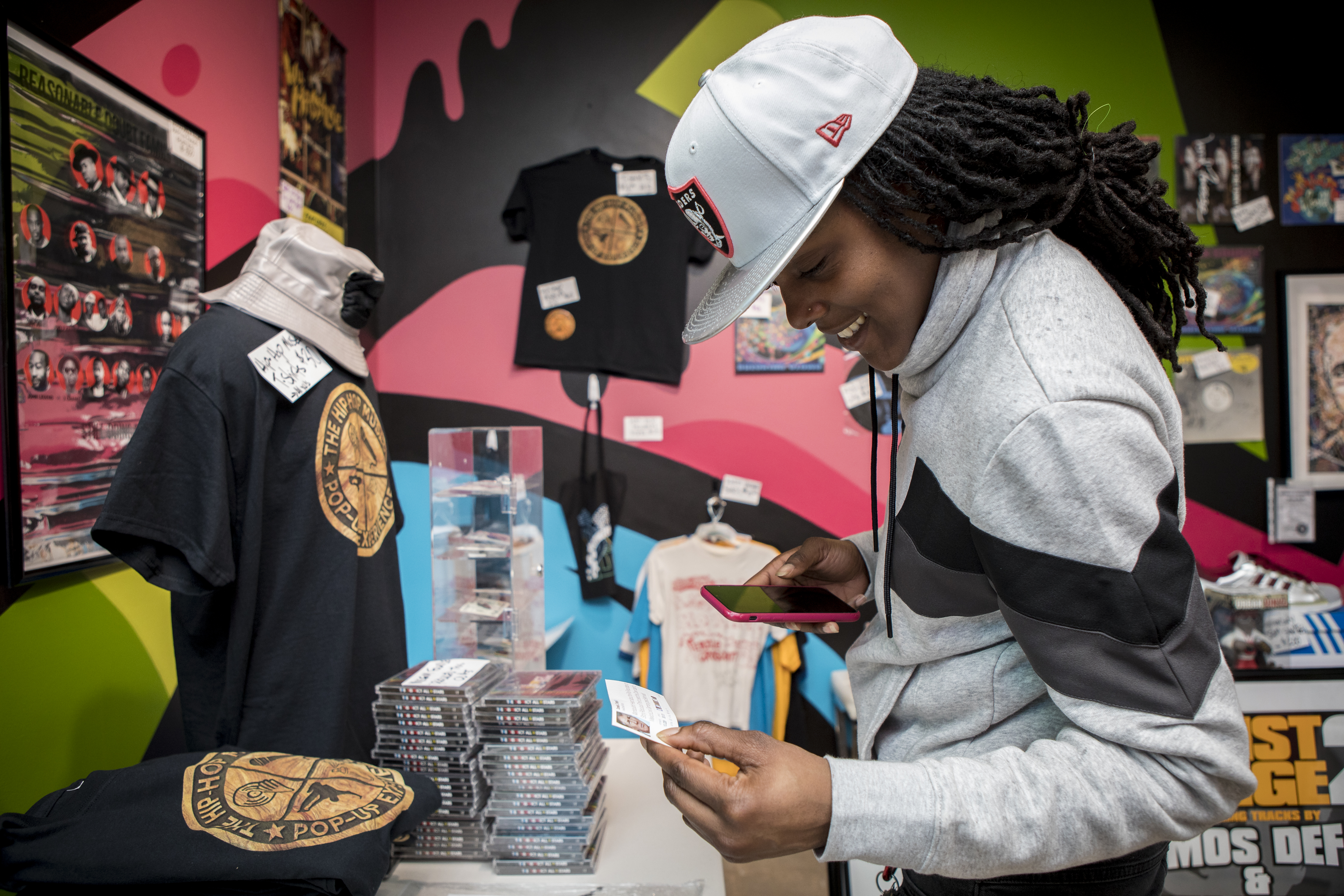 Tiara Jones looks at a variety of items on sale inside The Hip-Hop Museum, a Pop Up Experience on Wednesday, February 6, 2019. Jones traveled from Baltimore to visit her friend in Washington, D.C. to see the museum. Jeremy Beaver and David Mays founded the museum. The museum will only be open in D.C. until February 18, before it moves to other cities, including Boston. Beaver, owner of Listen Vision Studios in D.C., has worked with multiple hip-hop artists such as Lil Wayne, T-Pain, Doug E. Fresh and KRS-ONE among others. Mays is the founder of The Source Magazine, a magazine devoted to rap and hip-hop music and culture. John Boal photo/for The Boston Globe