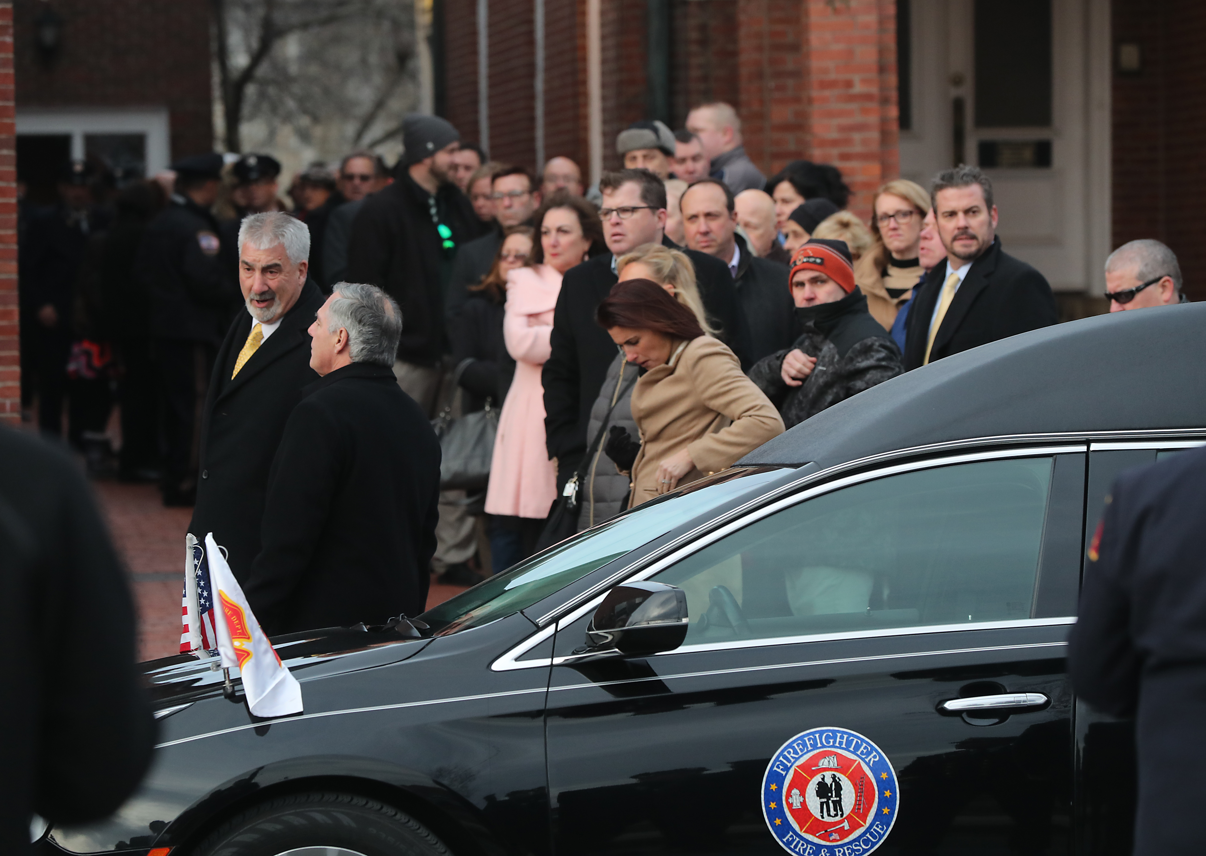 A procession of mourners gathered at the church.