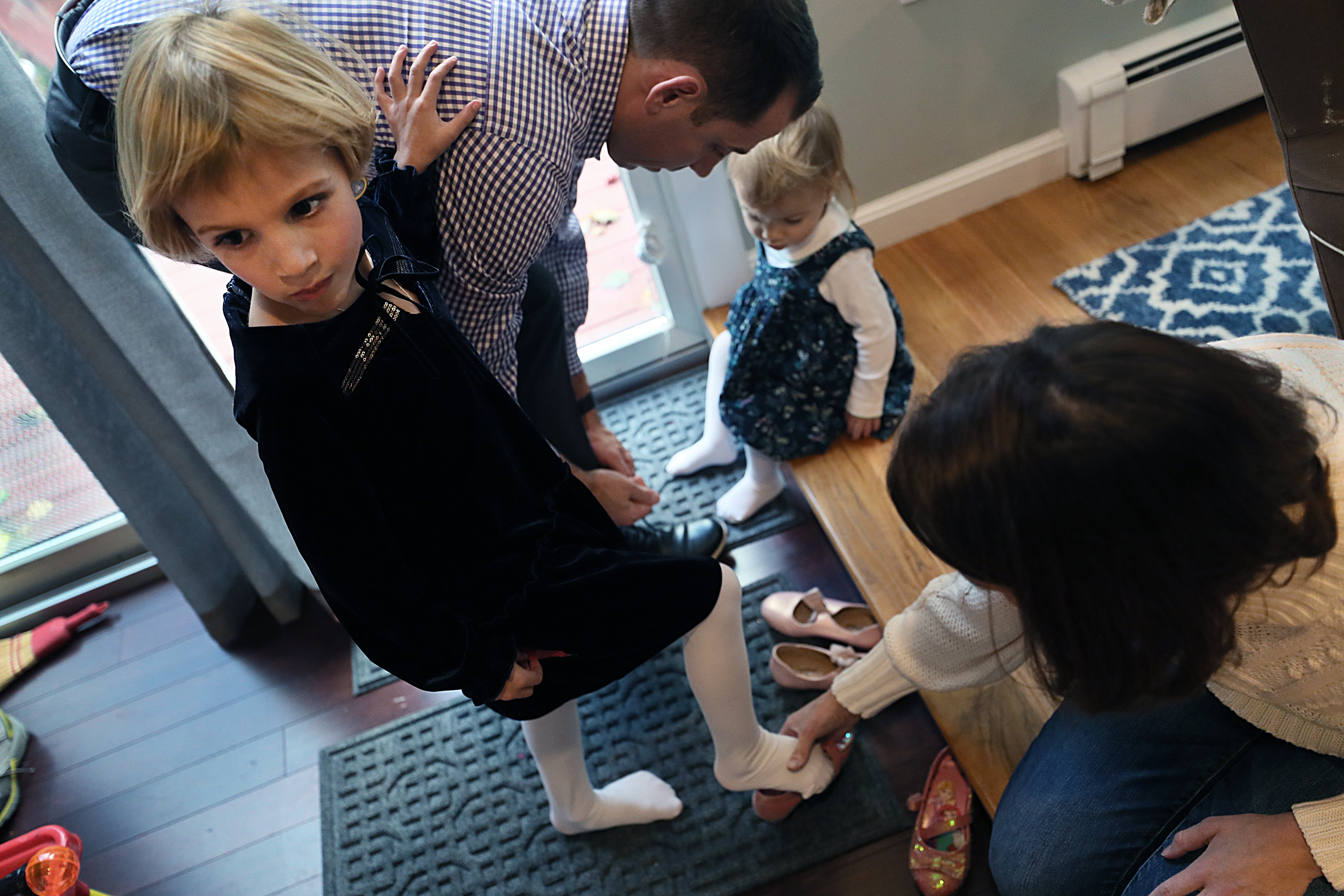 Five-year-old Michaela, who recently came out as transgender, with her father Michael, mother Liza, and one of her three sisters.