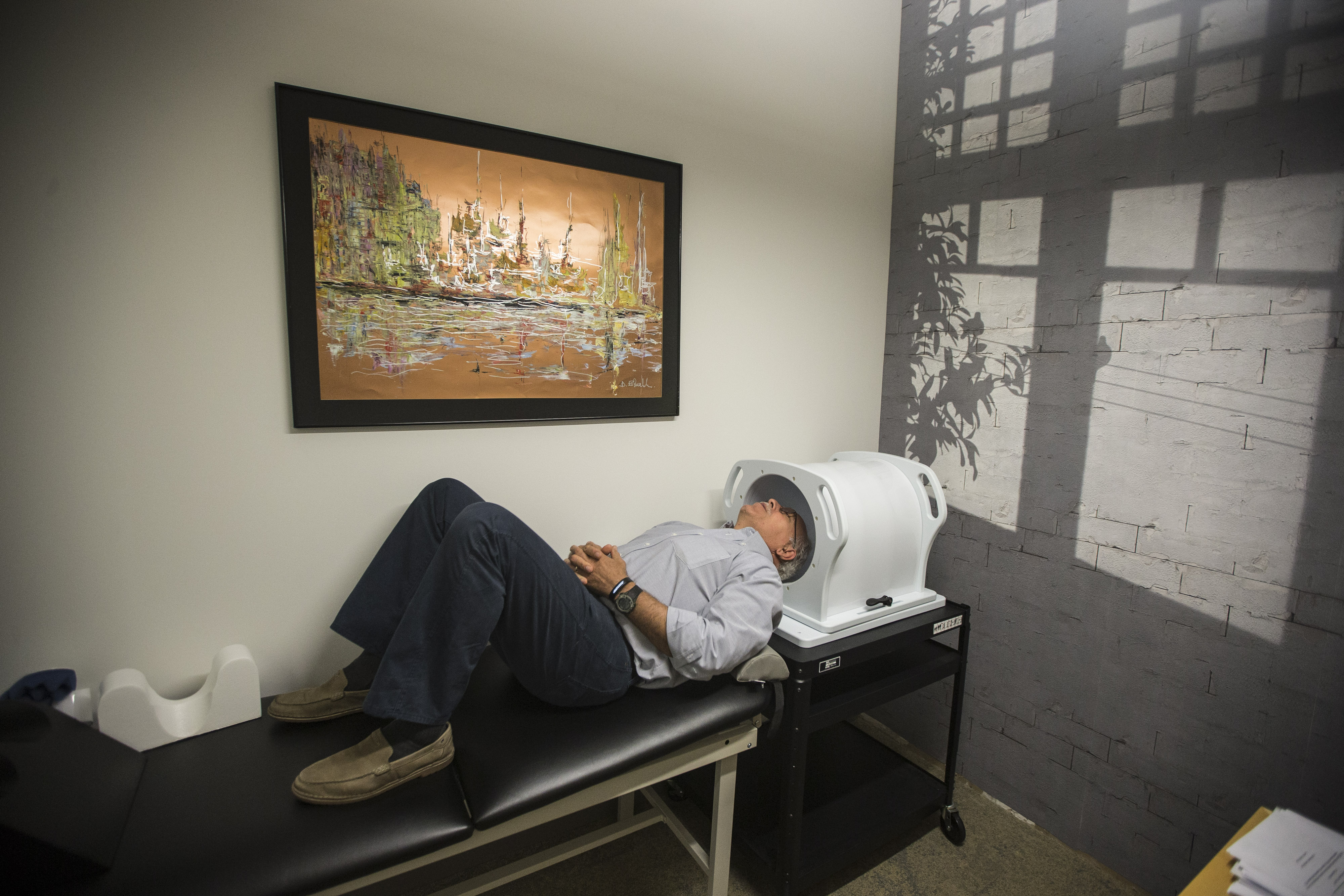 Tal Medical’s engineering head Mike Madden demonstrates a neurostimulation device.
