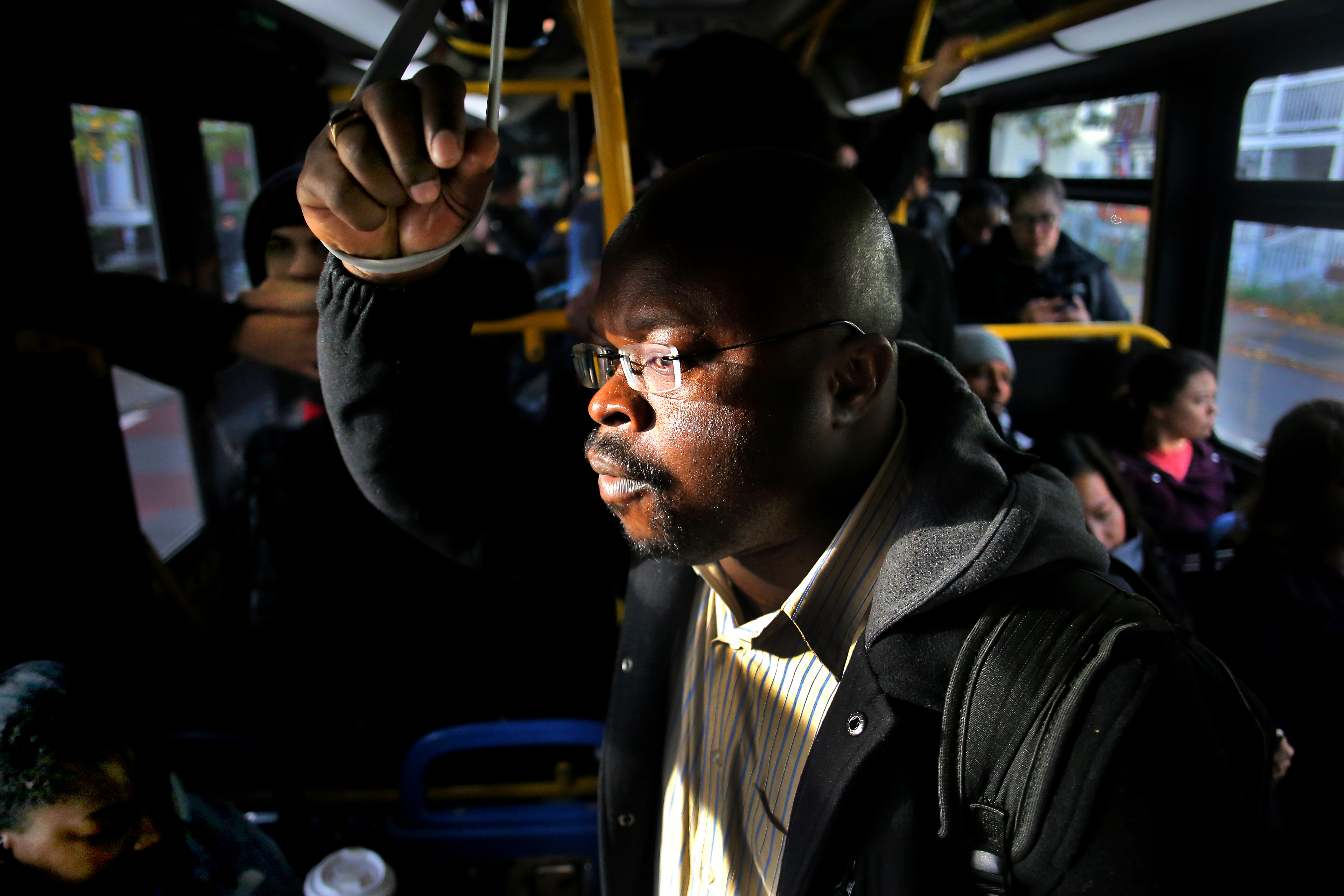 Uzoma Okoro rides the 34 bus to Forest Hills Station, along a dedicated bus lane, on the morning commute into Boston.