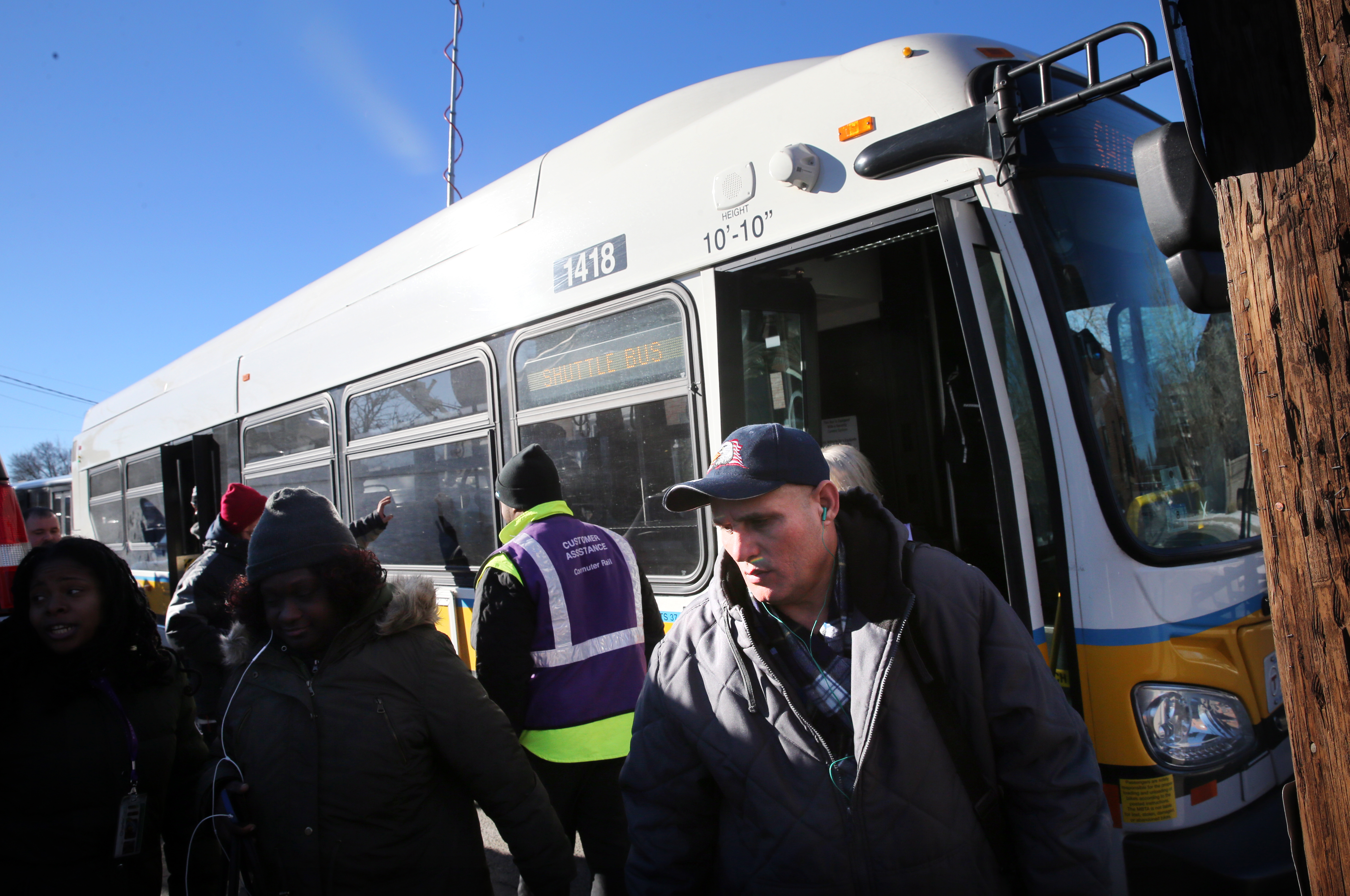 A shuttle bus arrived at the Andover commuter rail station on Tuesday. Passengers were bussed for part of Tuesday morning’s commute between Lawrence and Andover stations. Track issues on the Haverhill line trickled down and affected many commuter rail trips on trains heading to and from North Station.