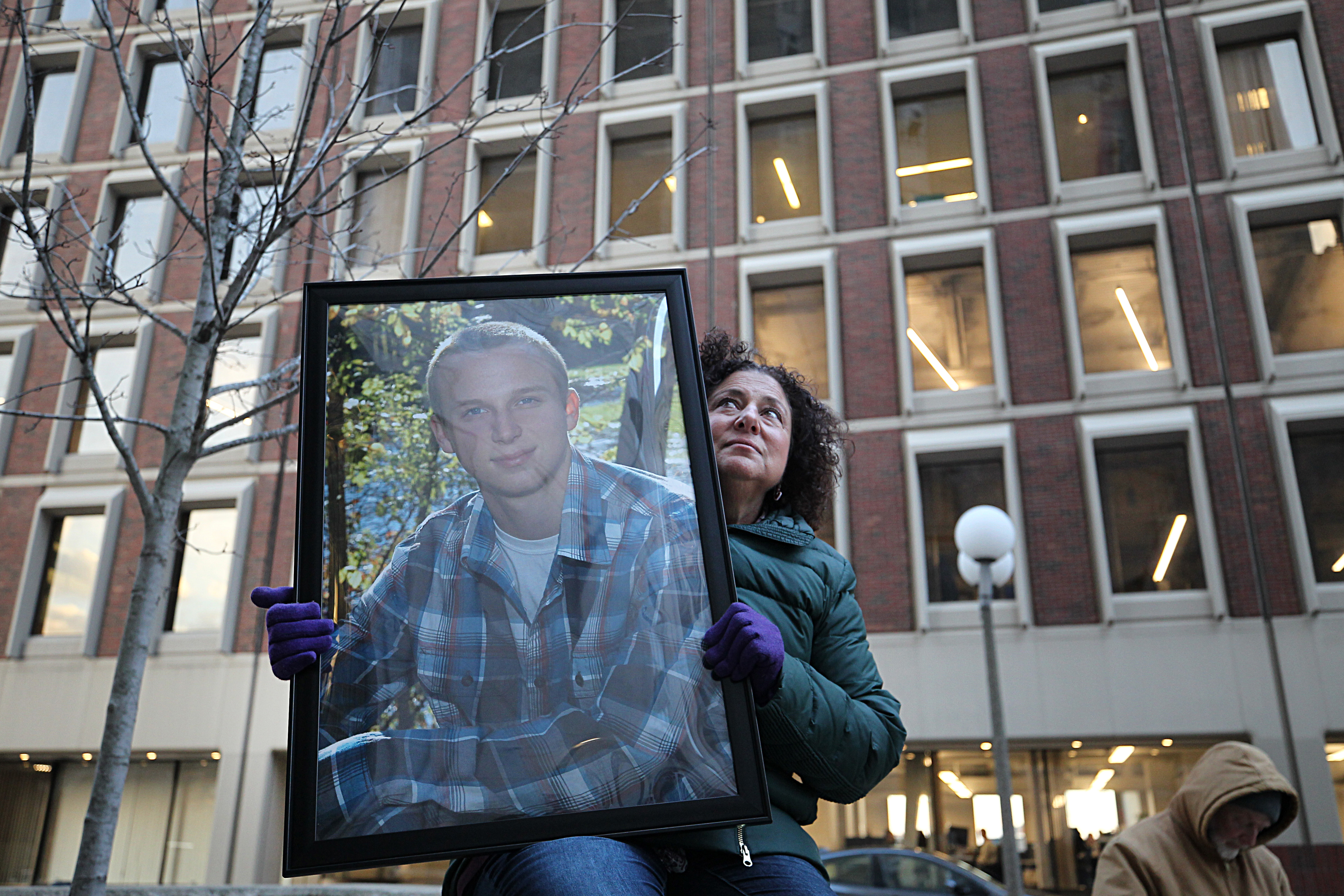 Nancy Tobin held a photo of her son, Scott, who died at age 22 as a result of the opiod crisis.