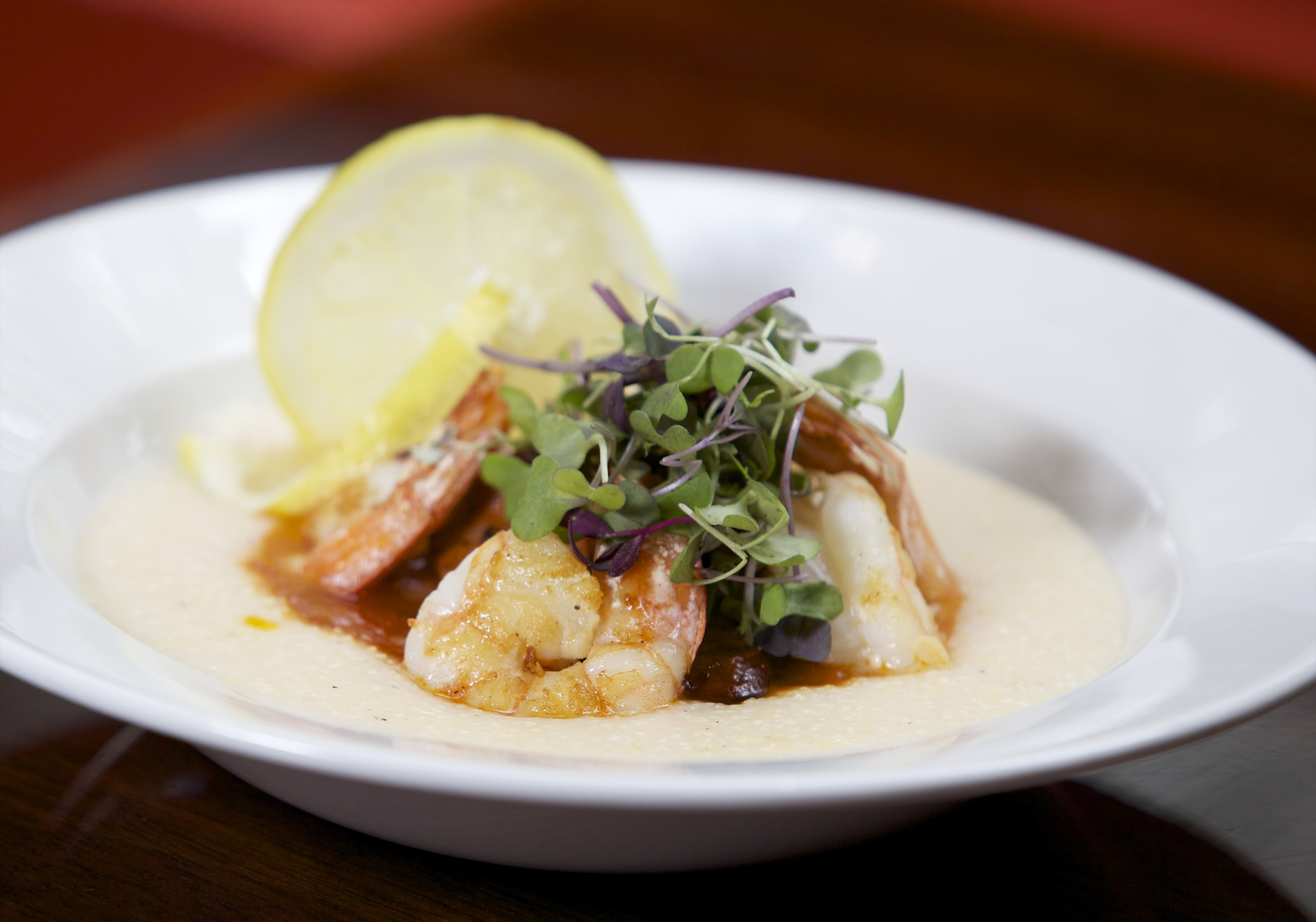 Grits are topped with shrimp and andouille sausage.