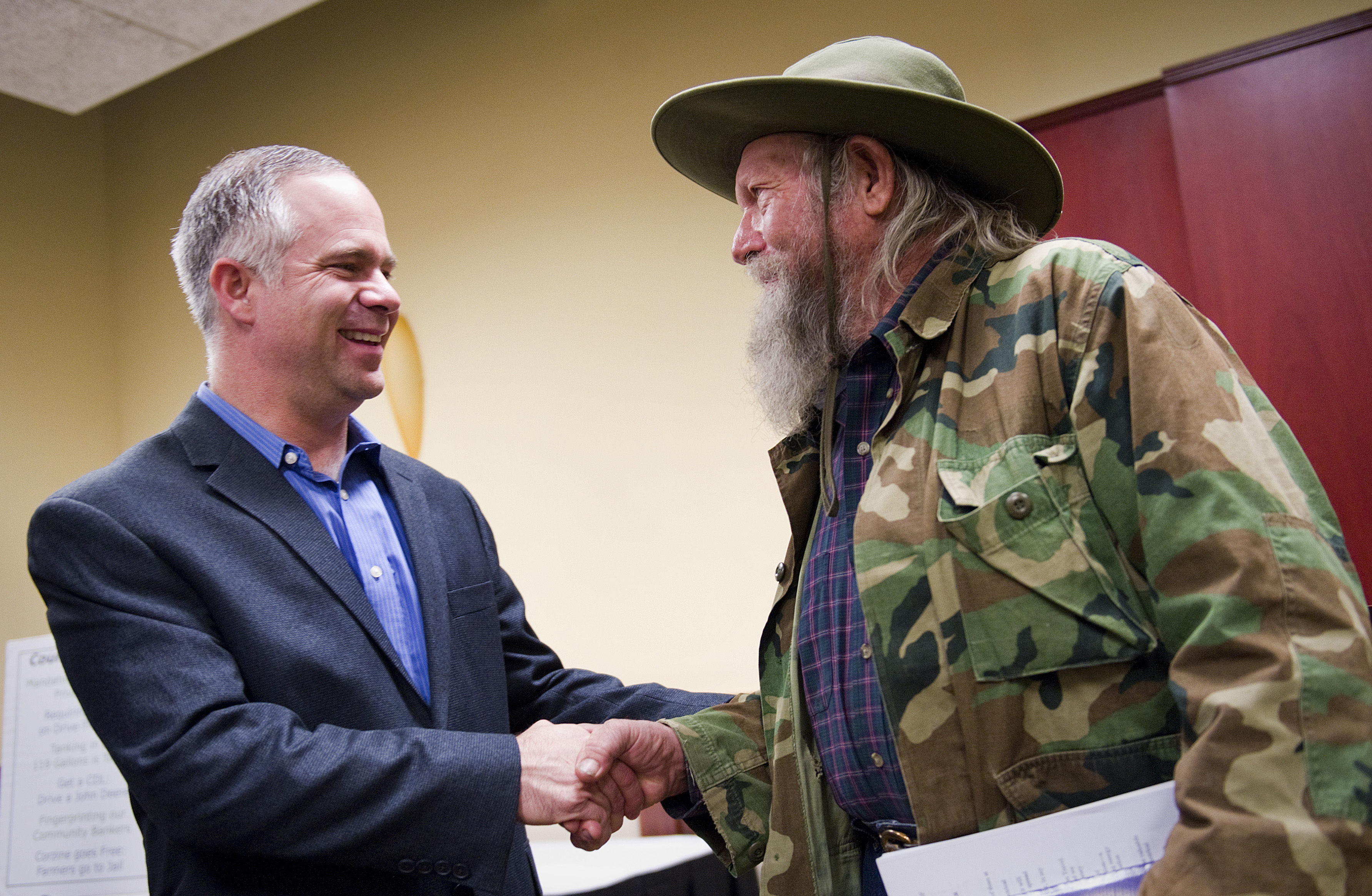 Representative Tim Huelskamp, shown with a constituent, represents one of the country’s most conservative congressional districts.