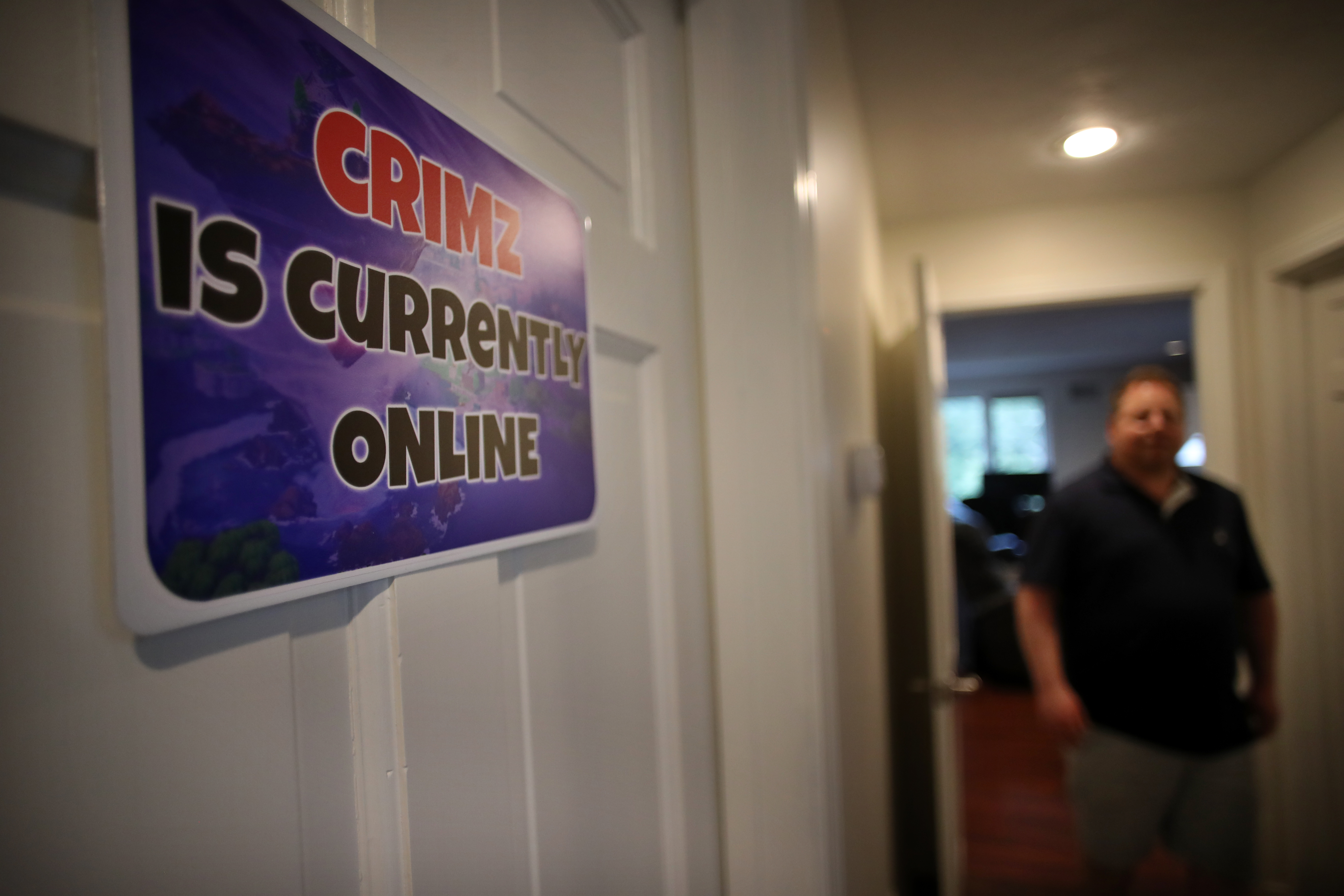 David Herzog approached the computer room, where his son Jordan was playing “Fortnite.”