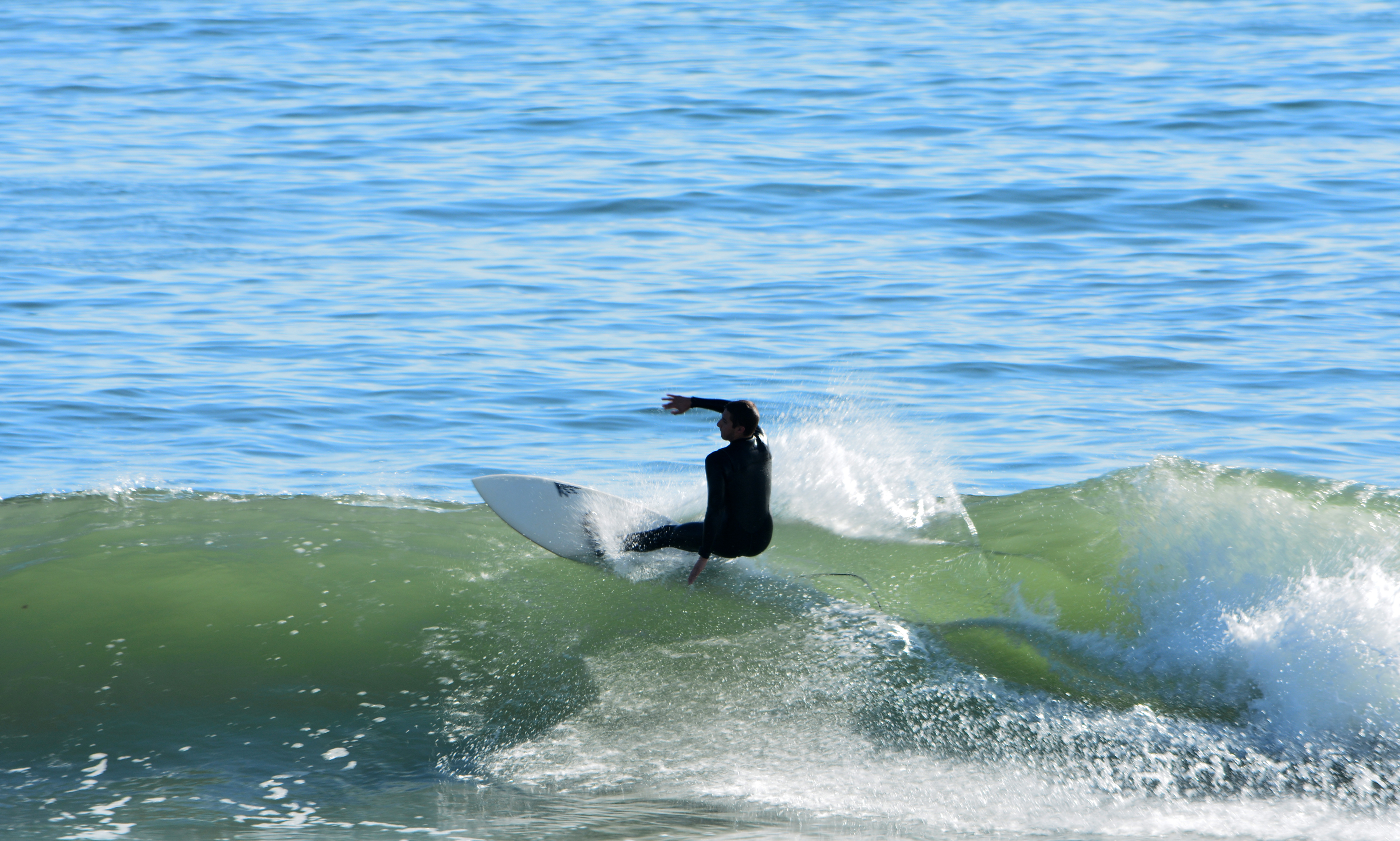A surfer hittng the waves in Rye, New Hampshire.